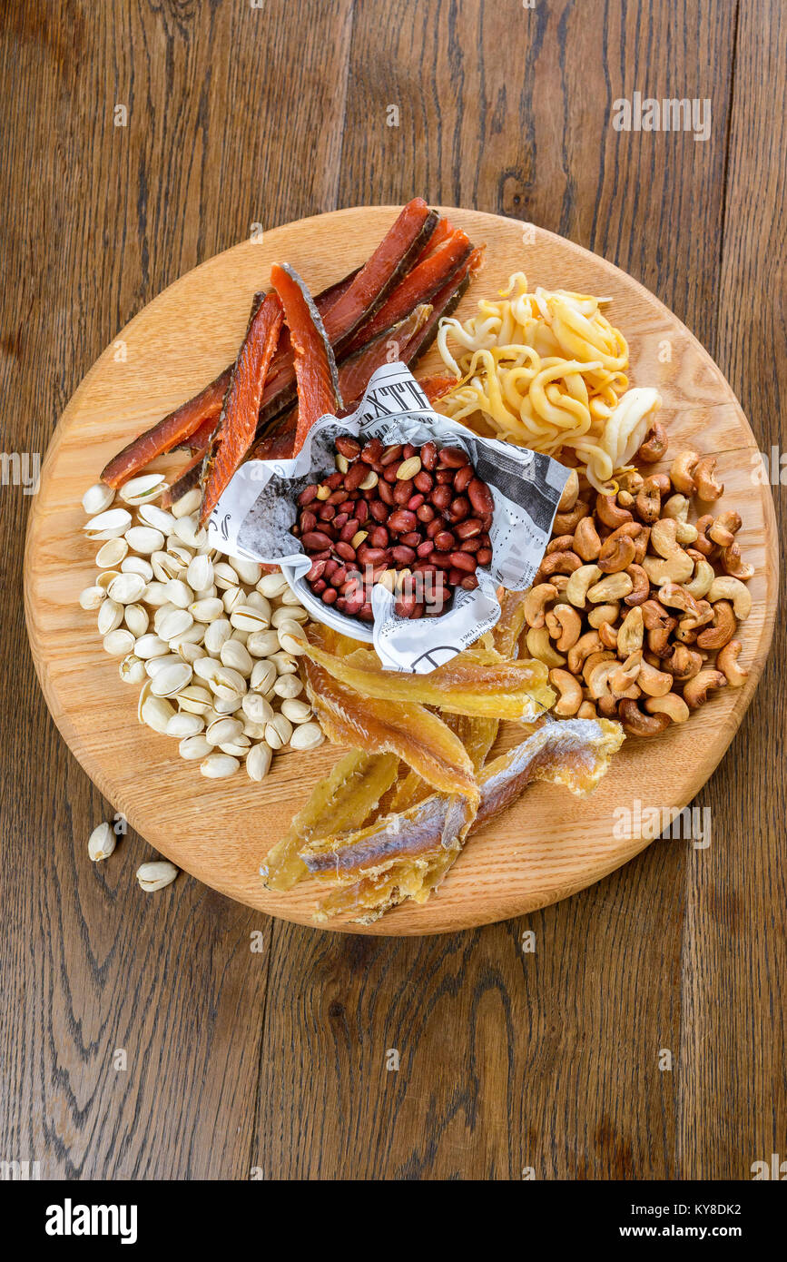 Different nuts and salted snacks tasteful with beer Stock Photo