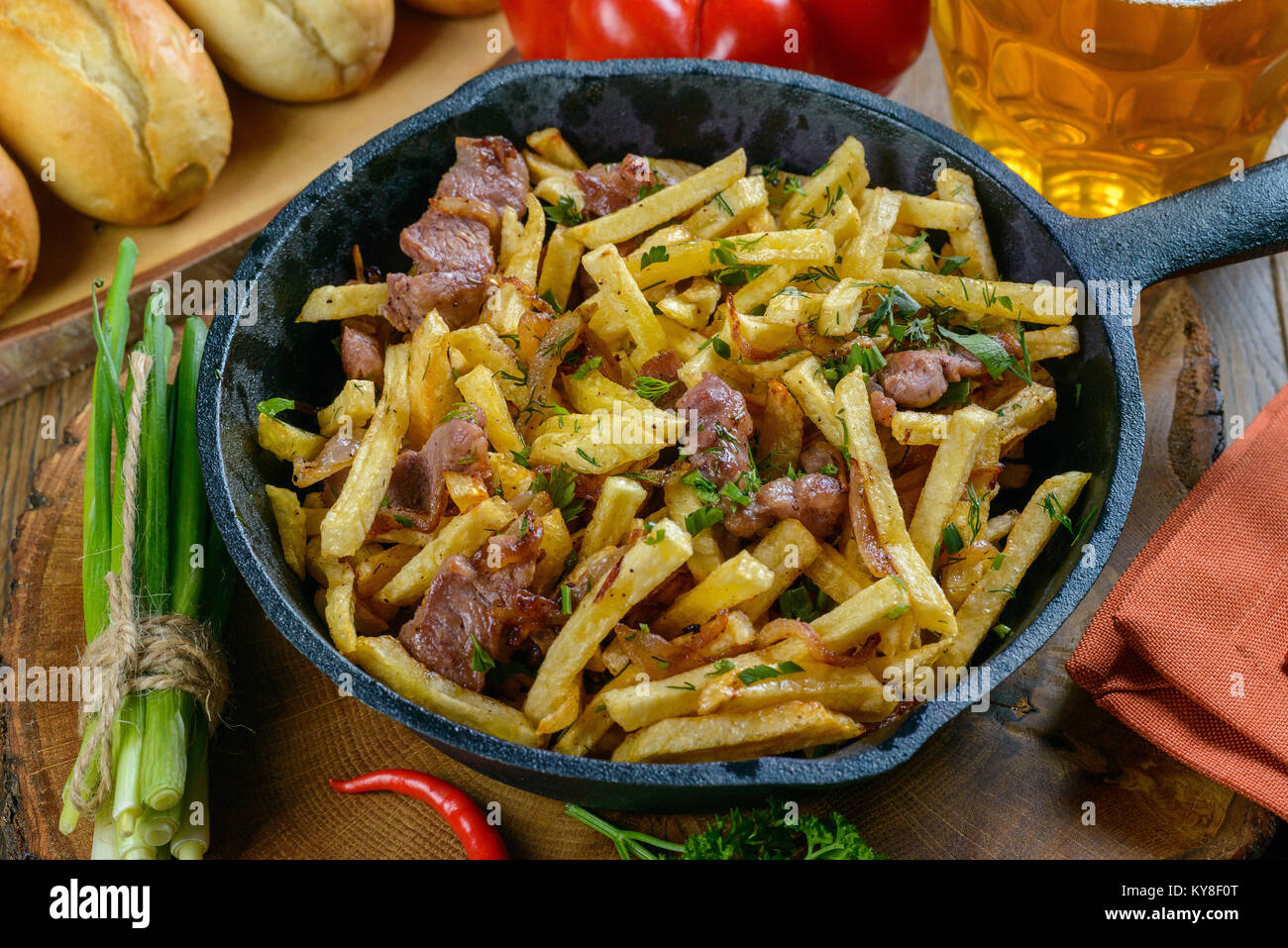 Fried potatoes with meat Stock Photo