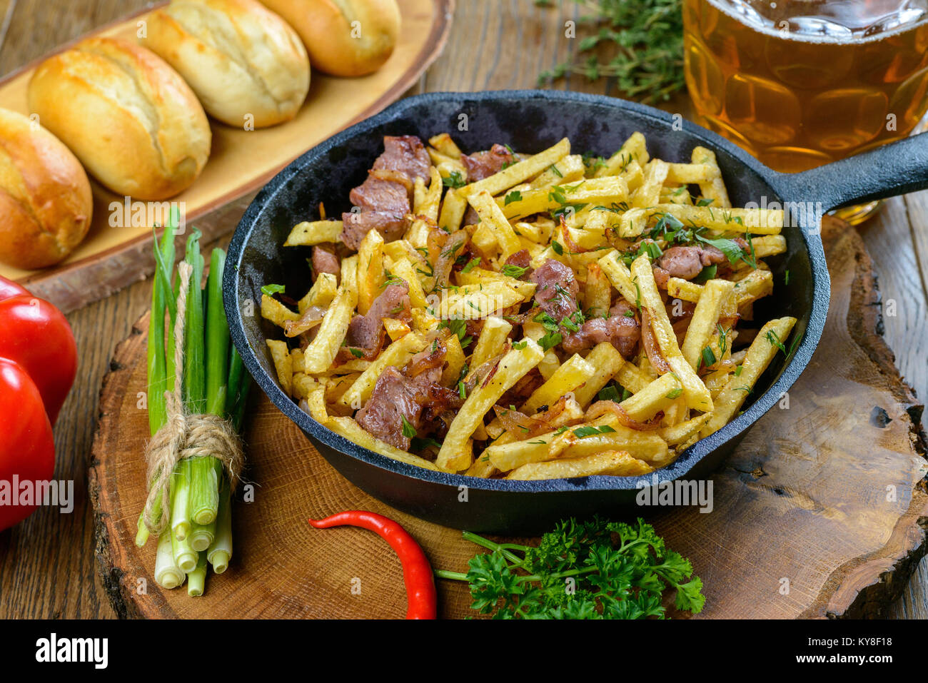 Fried potatoes with meat Stock Photo