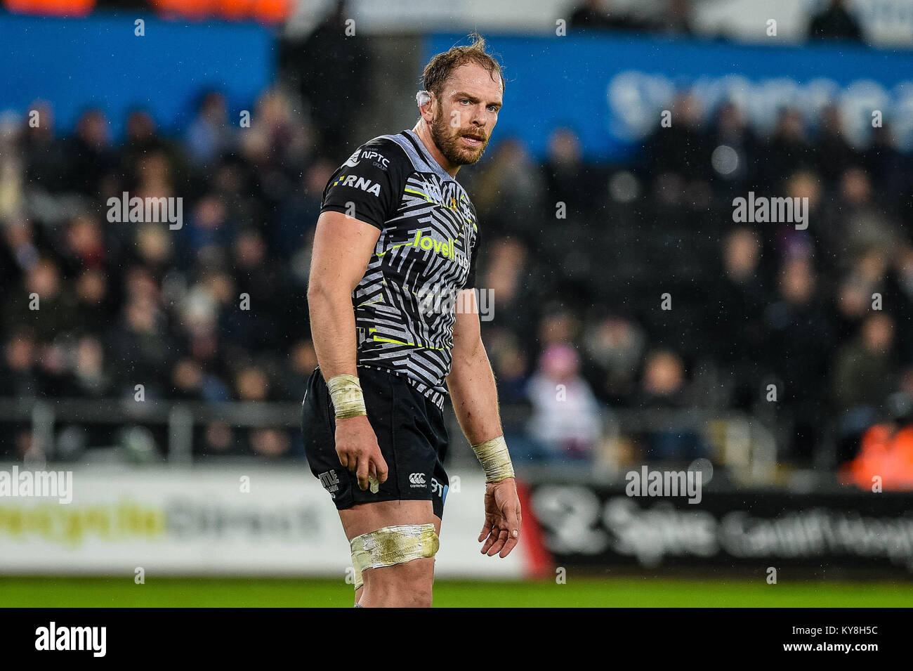 SWANSEA, WALES - JANUARY 13: Alun Wyn Jones of Ospreys looks on during ...