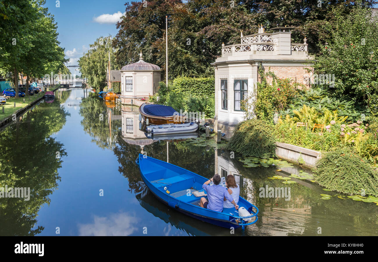 Tourists taking a sightseeing tour in a boat in Edam, Netherlands Stock Photo