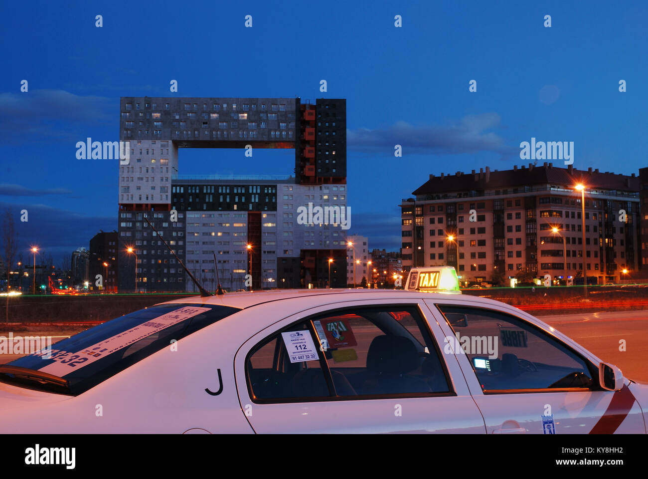 Taxi and El Mirador building, night view. Sanchinarro, Madrid, Spain. Stock Photo
