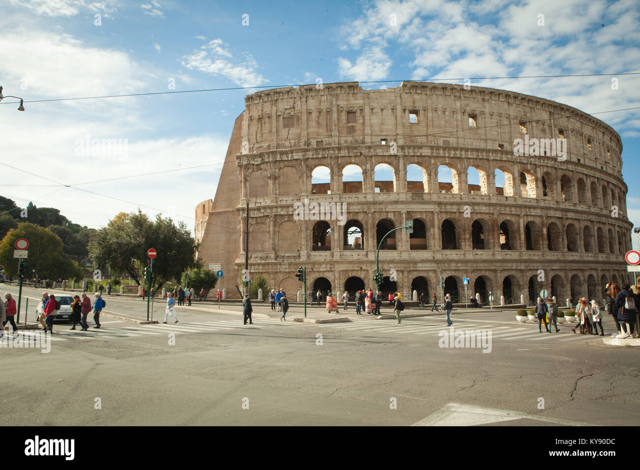 Rome, street view of colosseum. street crossing with people and