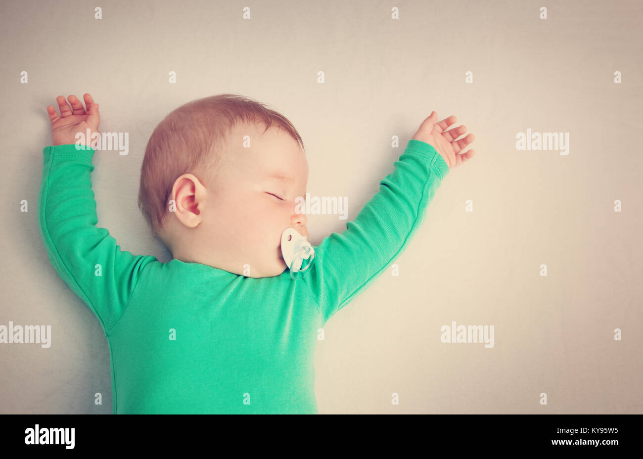 baby sleeping on the bed Stock Photo Alamy