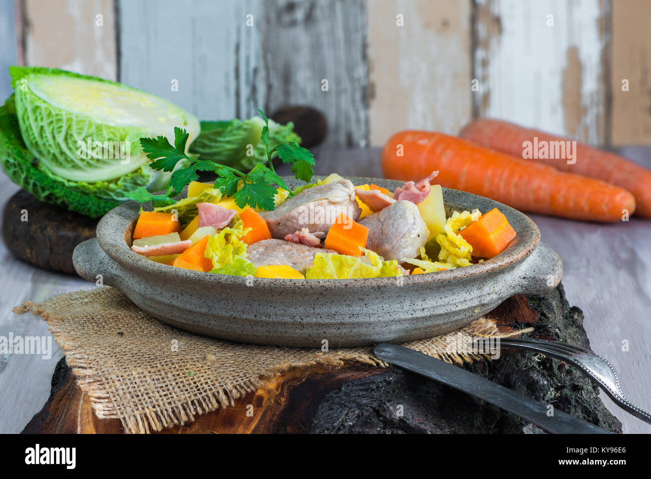 Irish pork stew with potatoes, cabbage, carrot, swede and bacon cooked in cider Stock Photo Alamy