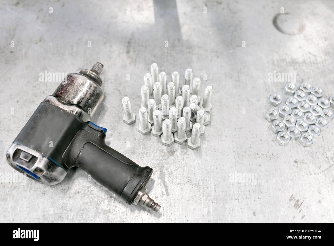 compressor wrench. Chromed screw nuts and bolts from above. Many screw