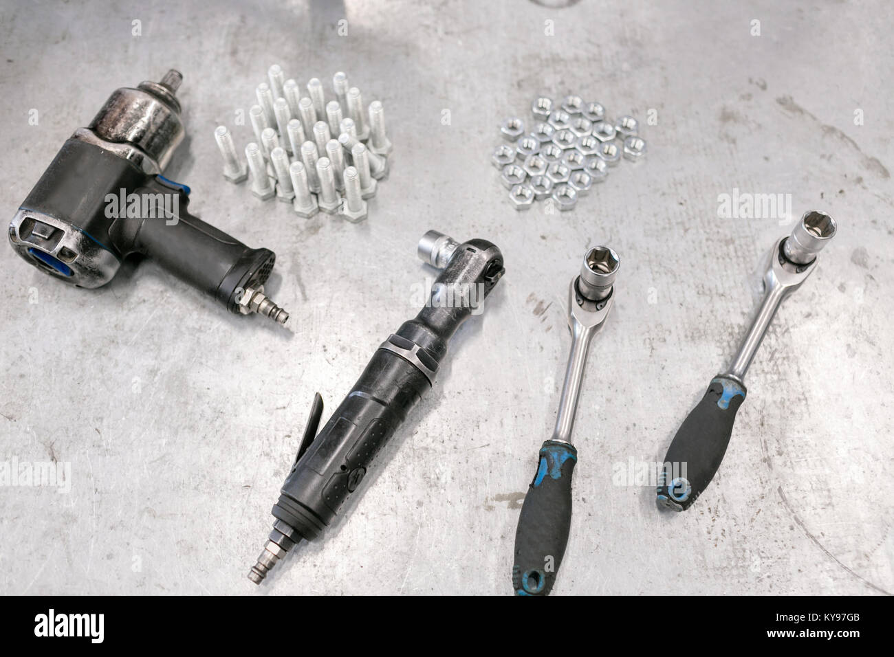 compressor wrench. Chromed screw nuts and bolts from above. Many screw