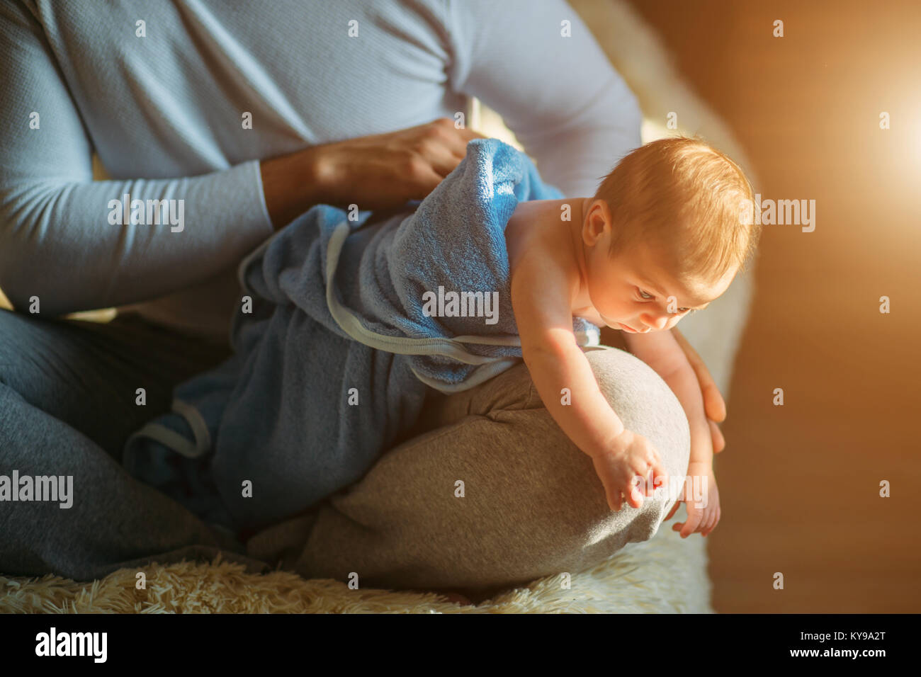 man drying his baby after showering and bathing Stock Photo Alamy