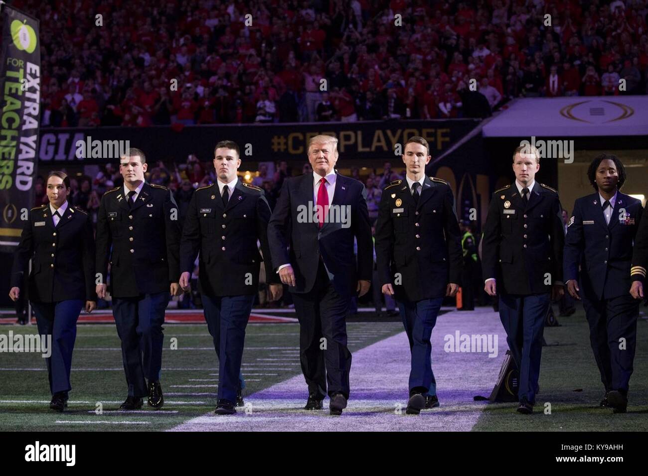 U.S. President Donald Trump walks on to the field for the NCAA College Football Playoff National Championship between the University of Alabama Crimson Tide and the University of Georgia Bulldogs January 8, 2018 in Atlanta, Georgia. Stock Photo