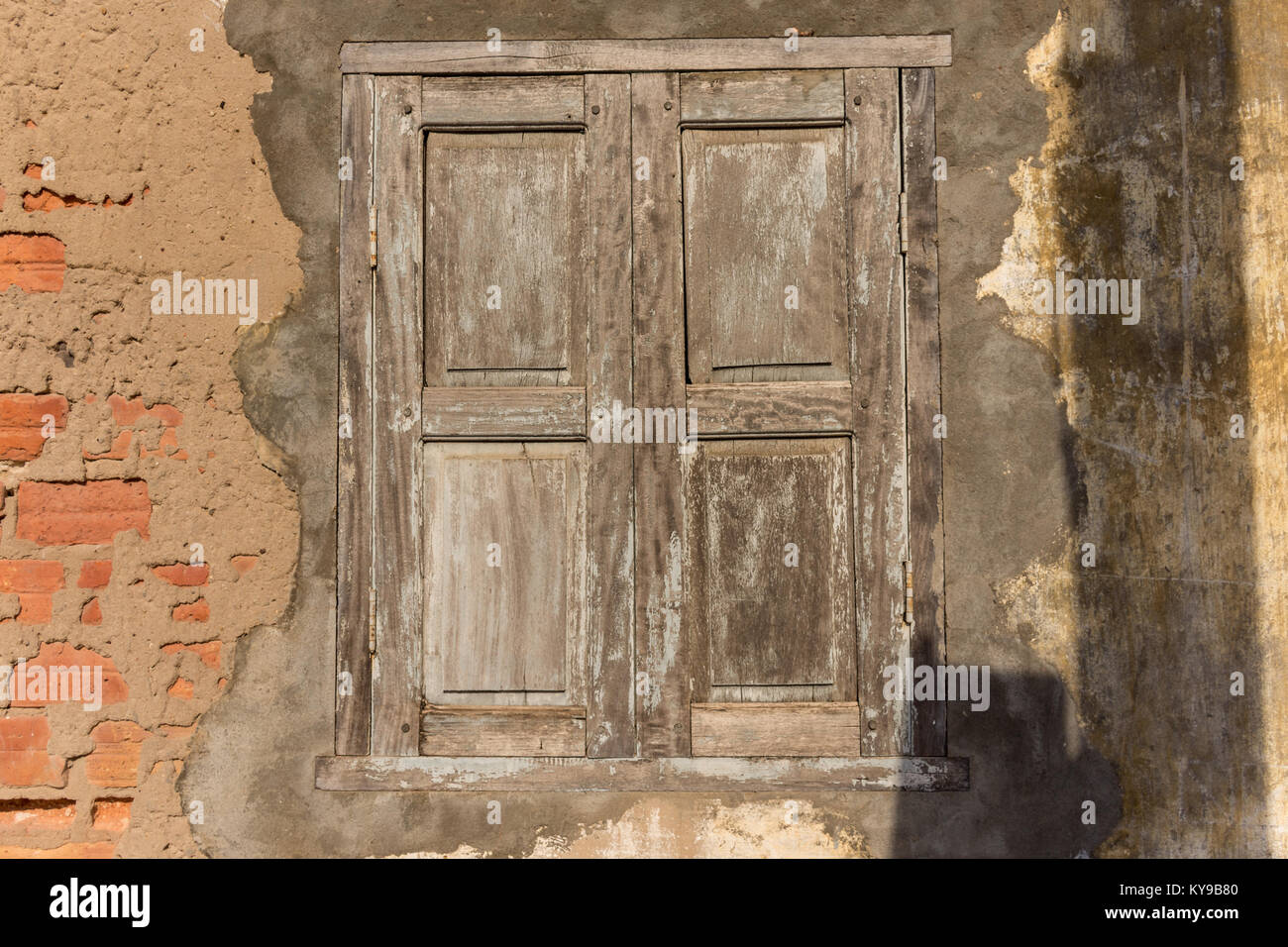 A closed weathered wooden shutter window Stock Photo - Alamy
