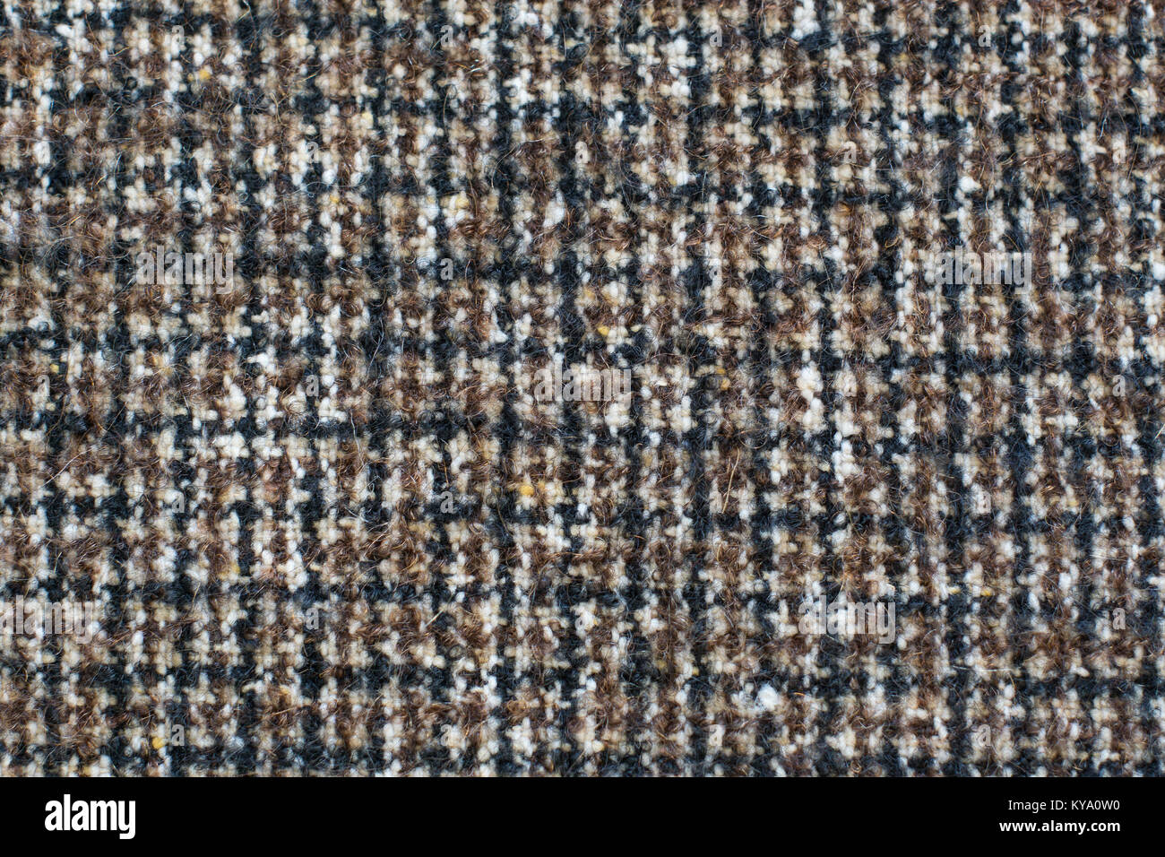 Wool or Tweed texture background. Fabric  checkered in brown. Houndstooth texture. Stock Photo