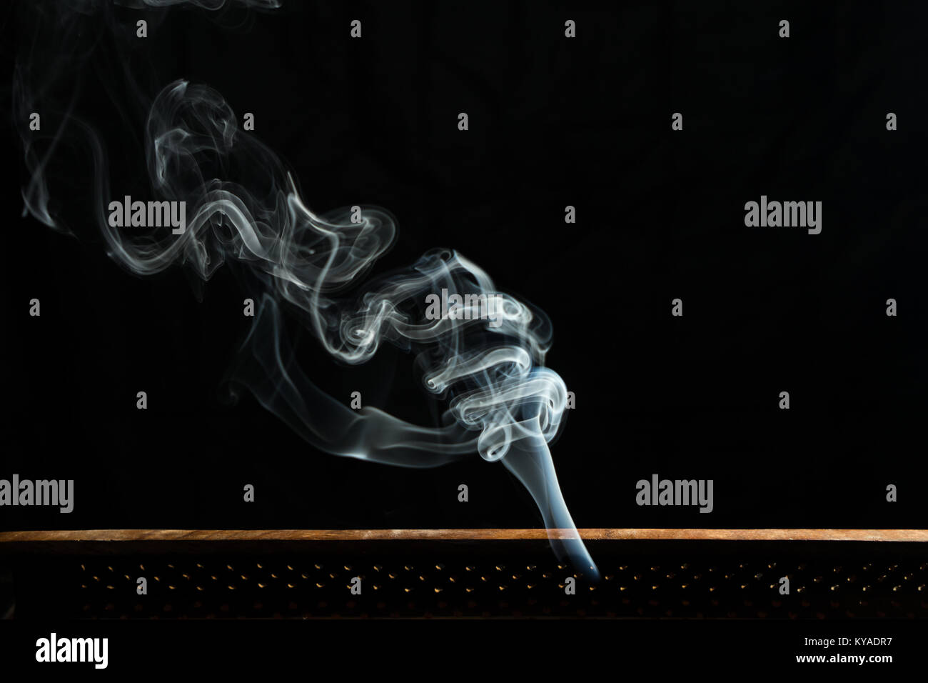 Incense smoke burning during meditation Stock Photo Alamy