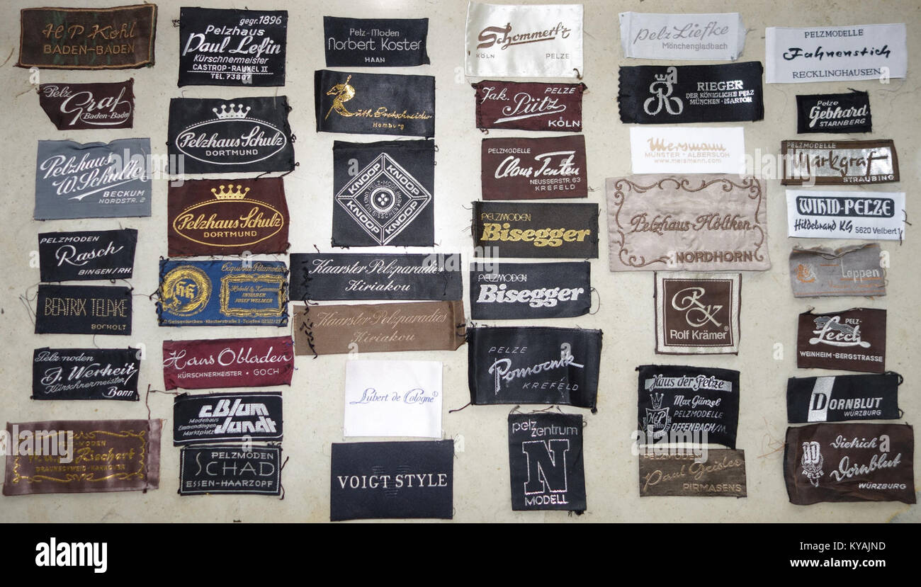 A set of web labels from German fur suppliers, likely part of a historical or modern collection documenting the textile and fur industry in Germany, including branding and product labeling. Stock Photo