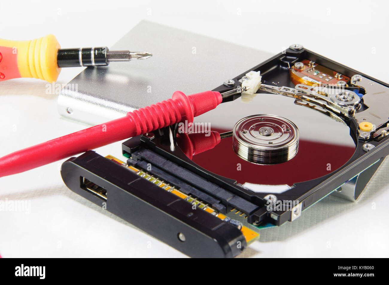 A broken hard disk with repairing and diagnostic tools Stock Photo Alamy