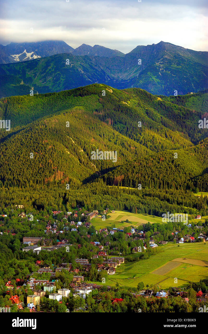 Poland, Tatra Mountains – Panoramic view of Zakopane town with Kasprowy Wierch, Skrajna Turnia and Swinica peaks in the background Stock Photo