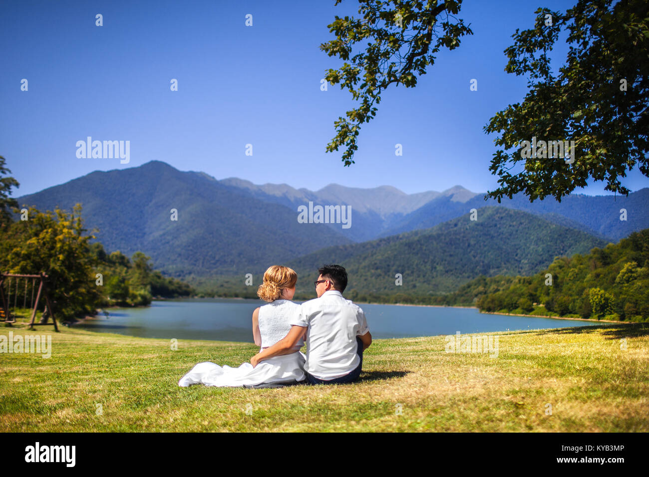 Bride and groom back view sitting hi-res stock photography and images ...