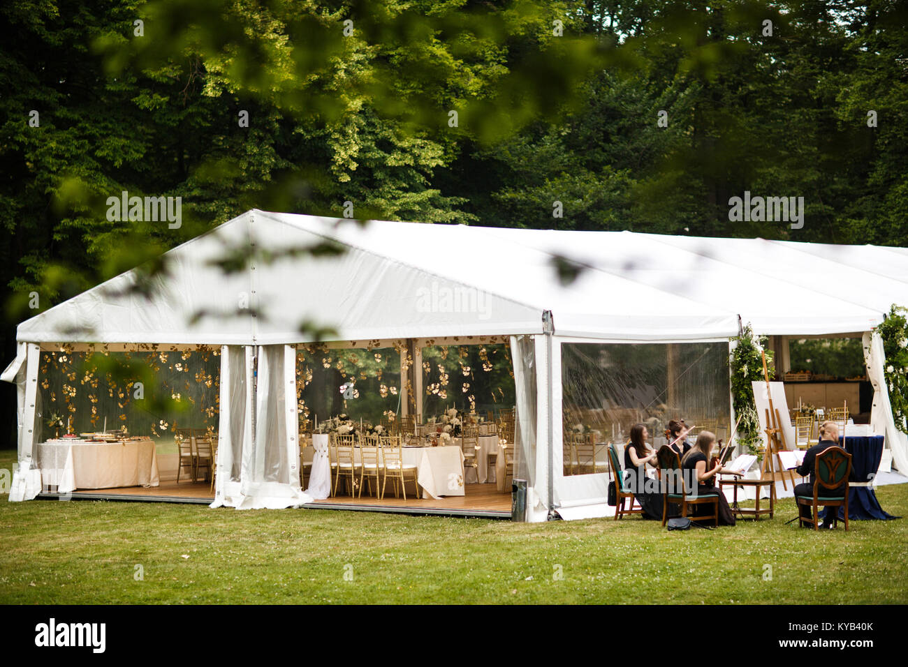 Large wedding awning and a group of musicians Stock Photo - Alamy