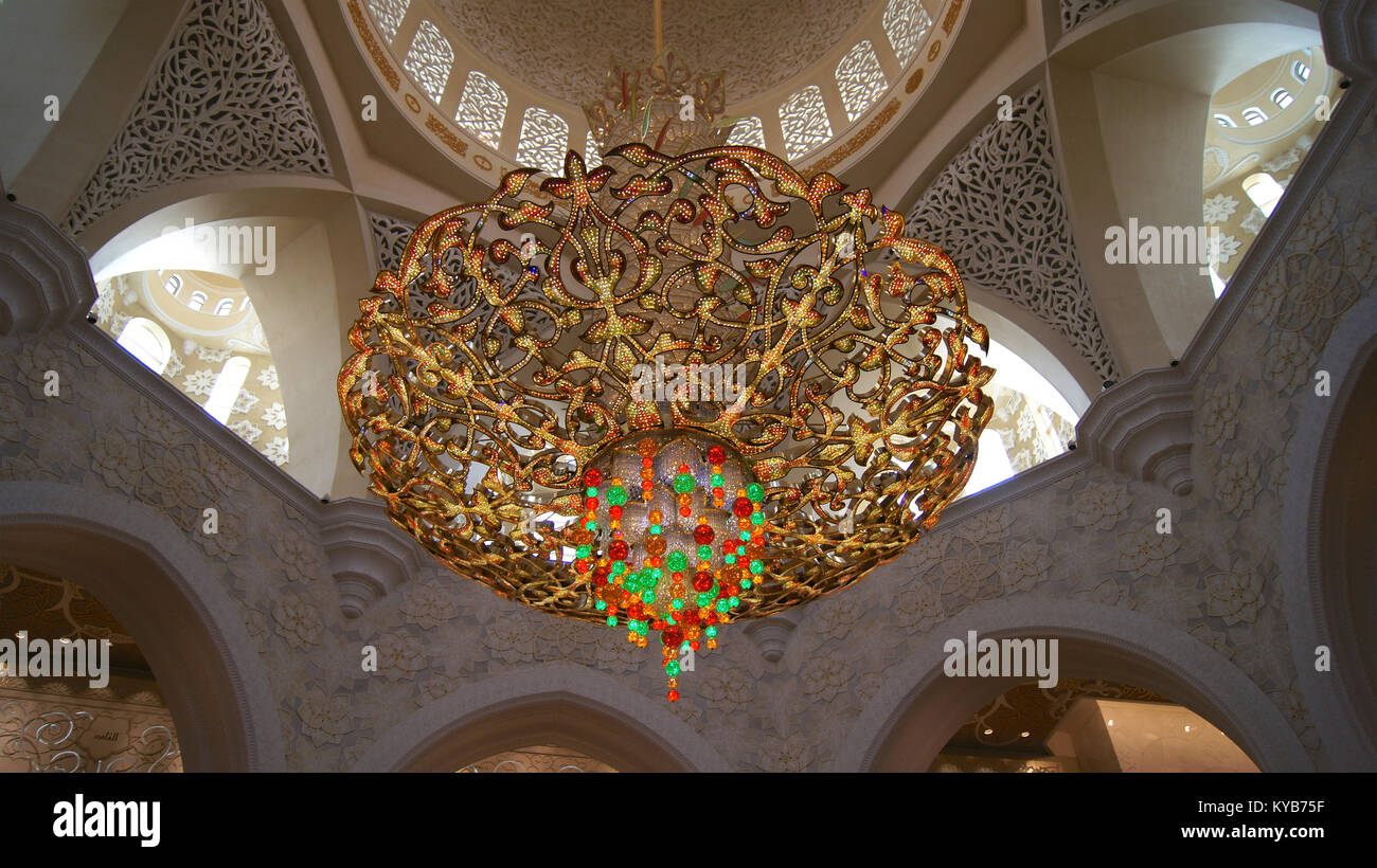 ABU DHABI, UNITED ARAB EMIRATES - APRIL 2nd, 2014: Interior design of Sheikh Zayad Mosque, Roof and chandelier inside the prayer hall Stock Photo