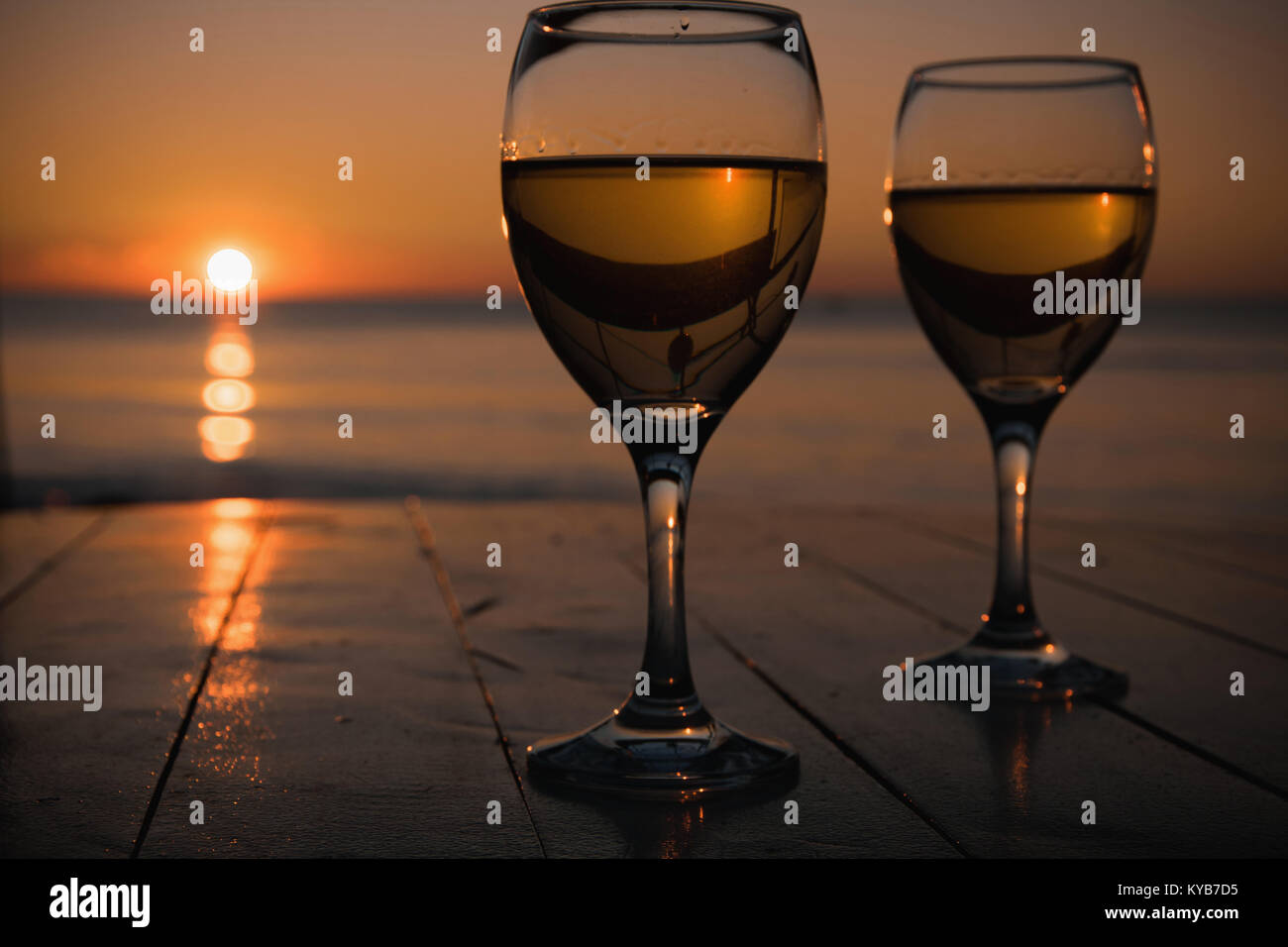 Two champagne flutes against sunset - Stock Image - F011/2837 - Science  Photo Library