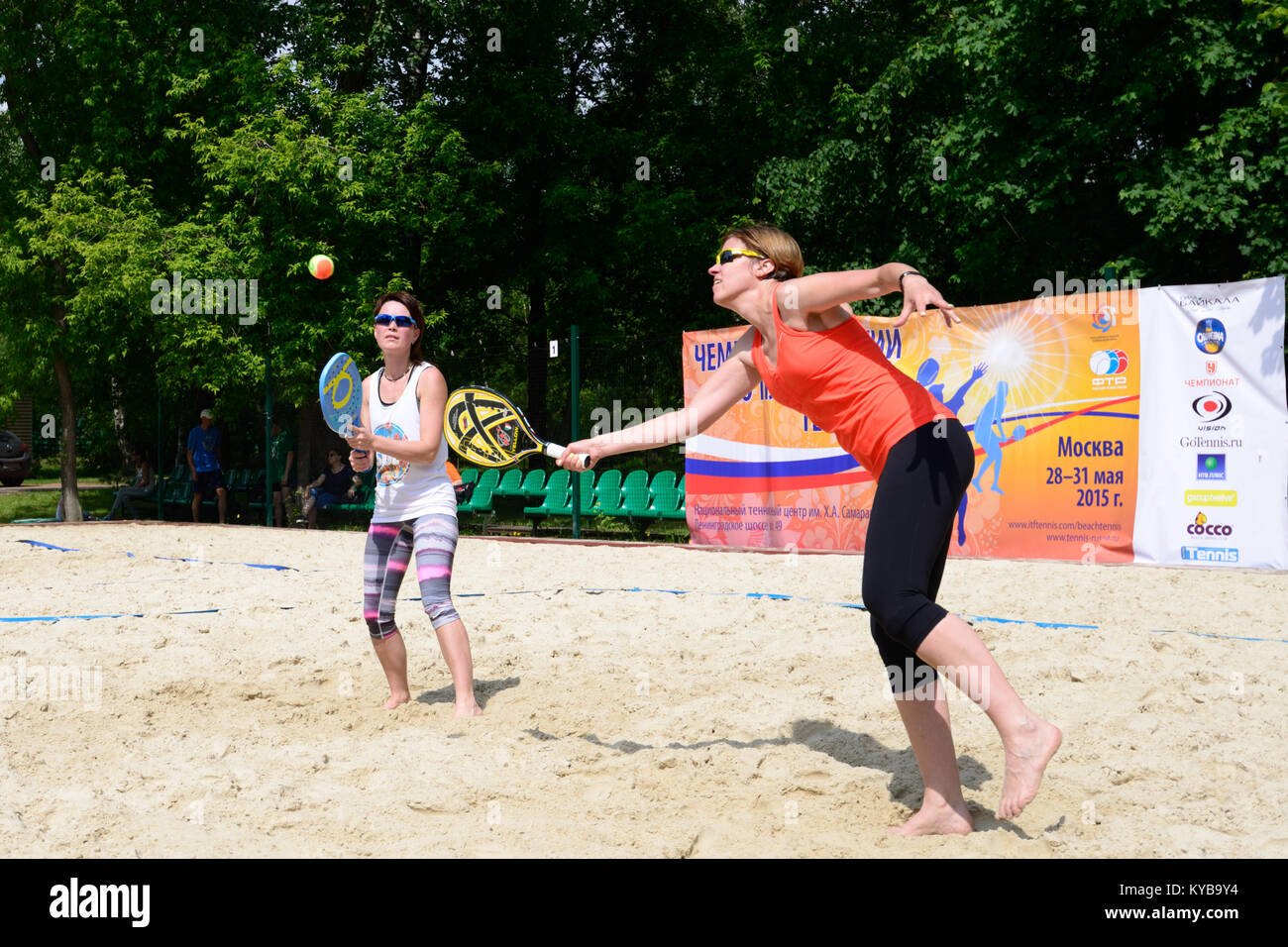 Moscow, Russia - May 29, 2015: Yulia Chubarova and Nikolay Guriev in the match of Russian beach tennis championship. 120 adults and 28 young athletes  Stock Photo