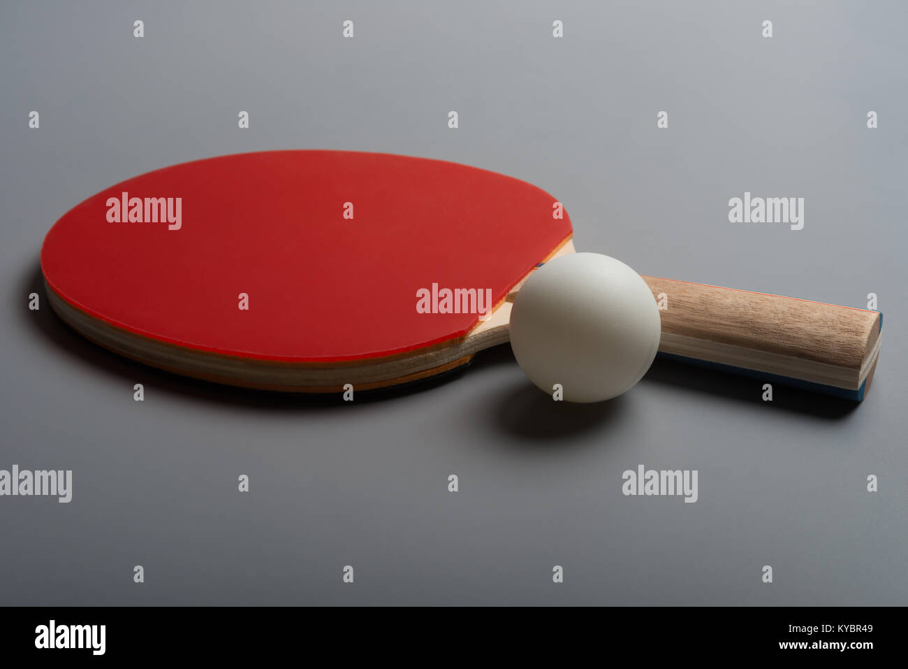 pingpong rackets and ball on a grey background Stock Photo