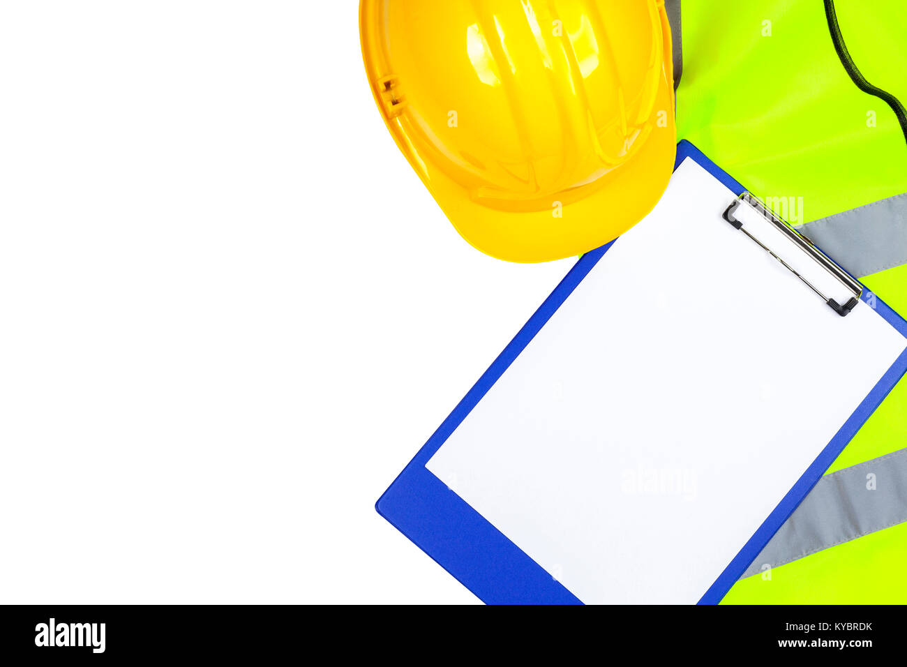 Saftey yellow hi vis vest and hard hat with a blue clipboard isolated on a pure white background Stock Photo