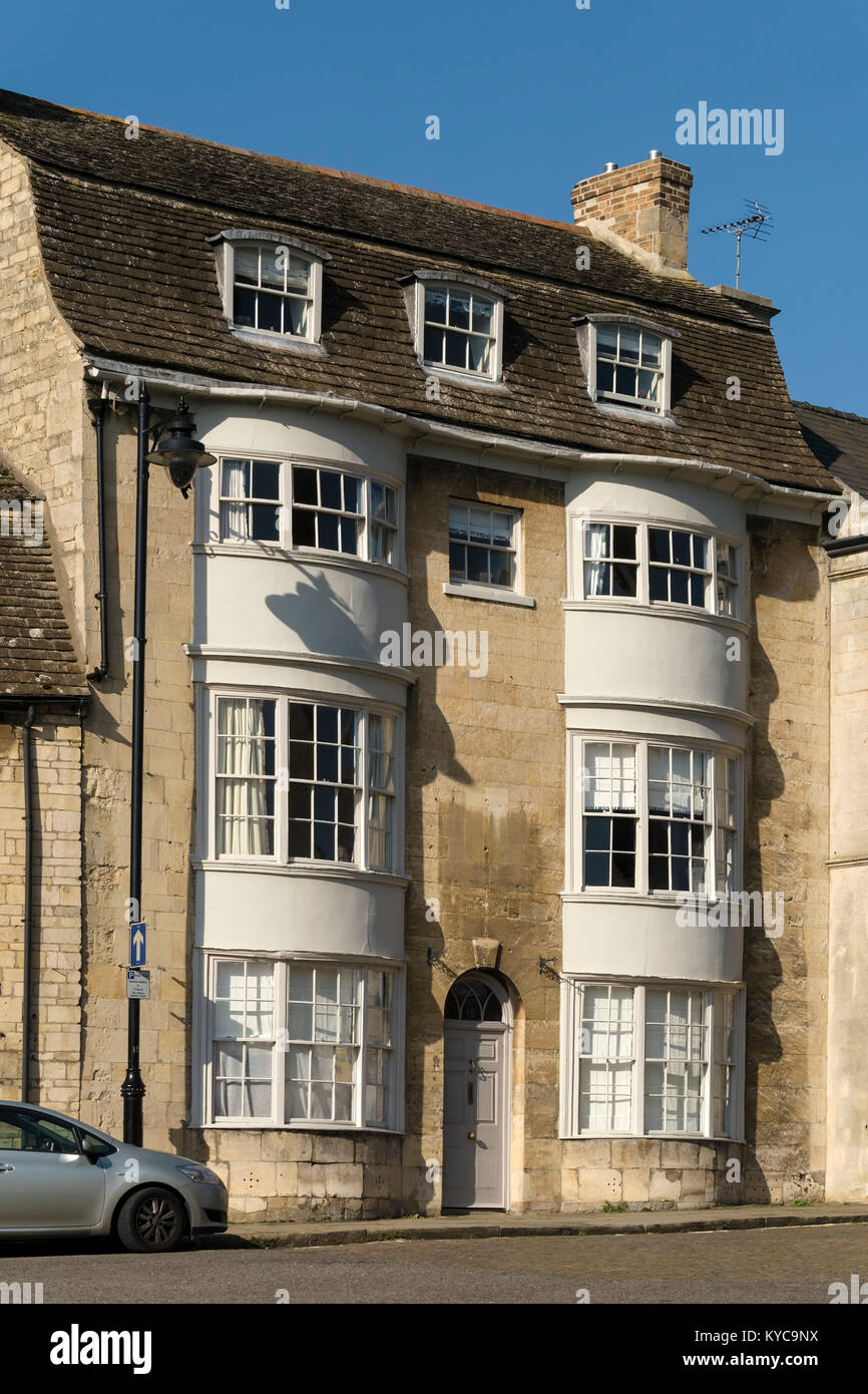 Old 3 storey double curved bay fronted stone house grade II listed building, 16 All Saints Place, Stamford, Lincolnshire, England, UK Stock Photo