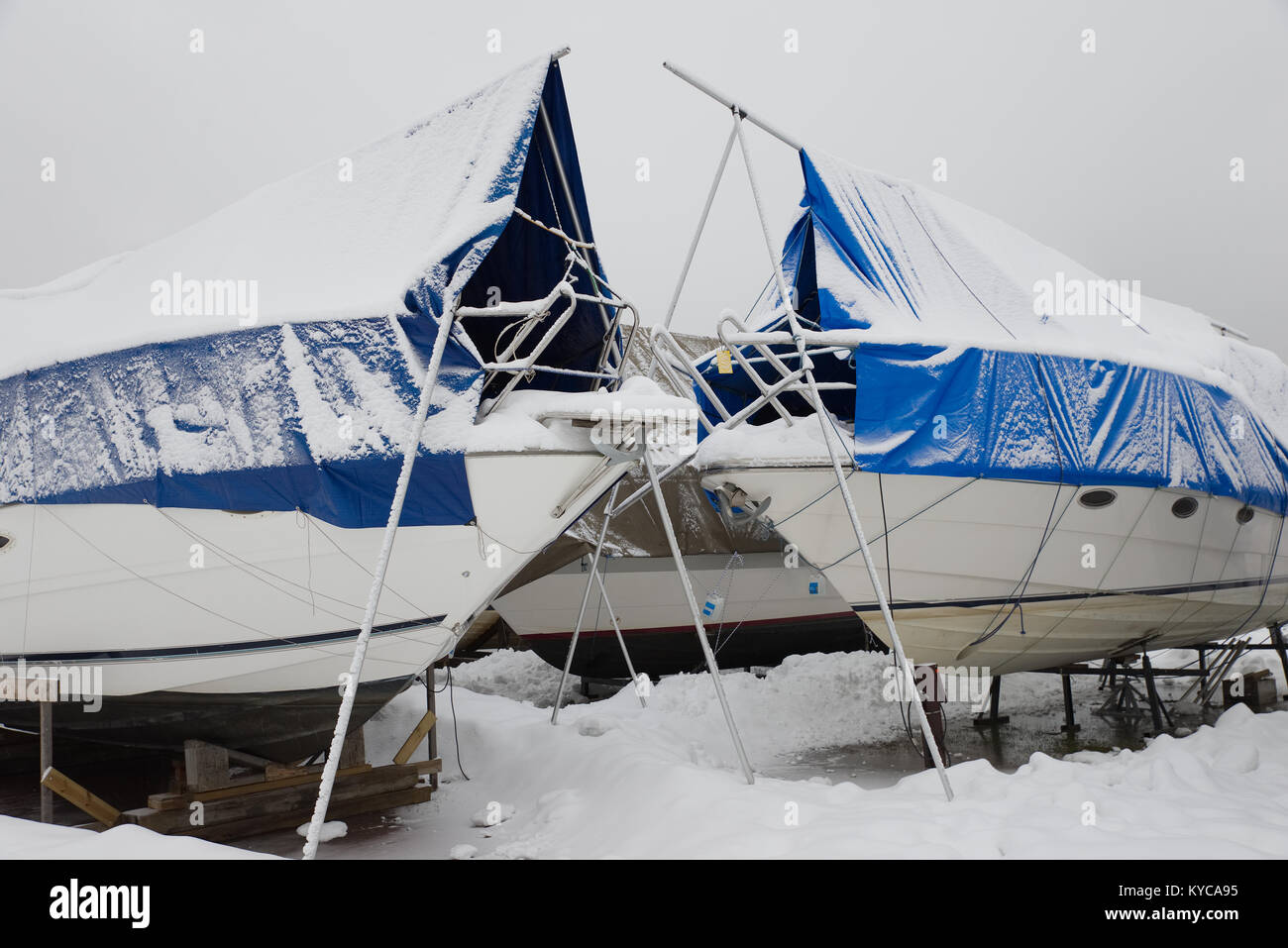 Pleasure boats stored on dry land at a marina during winter in Norway