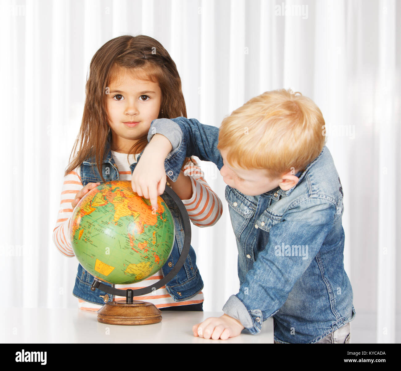 Kids on geography lesson Stock Photo