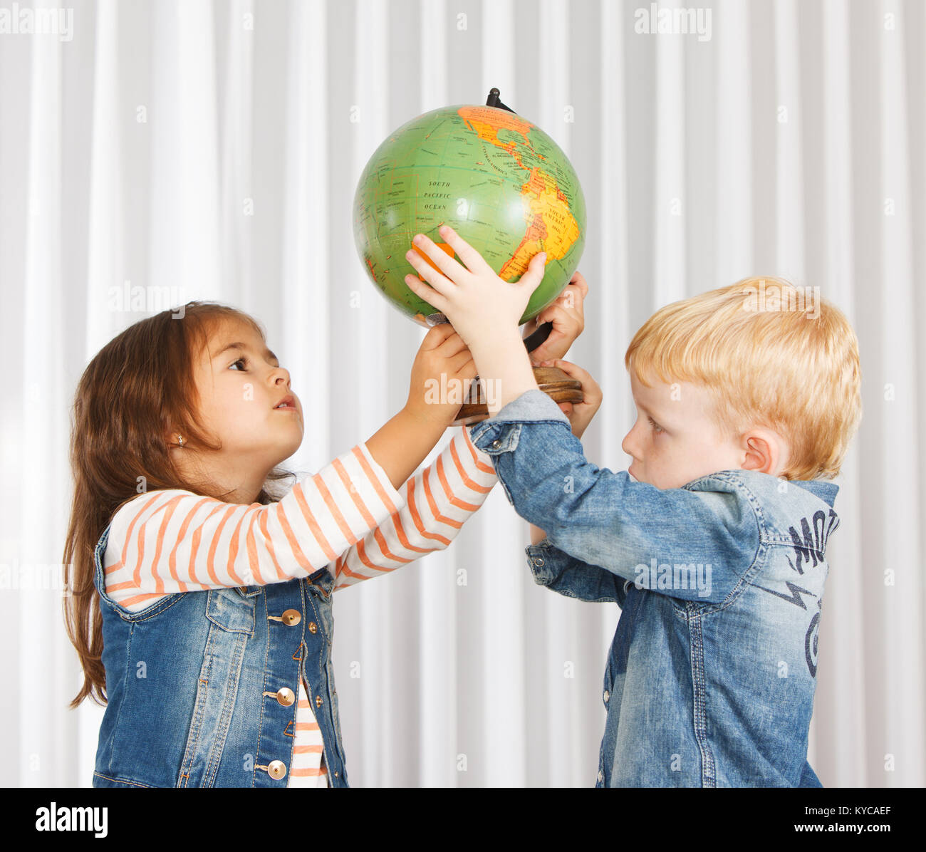 Kids on geography lesson Stock Photo