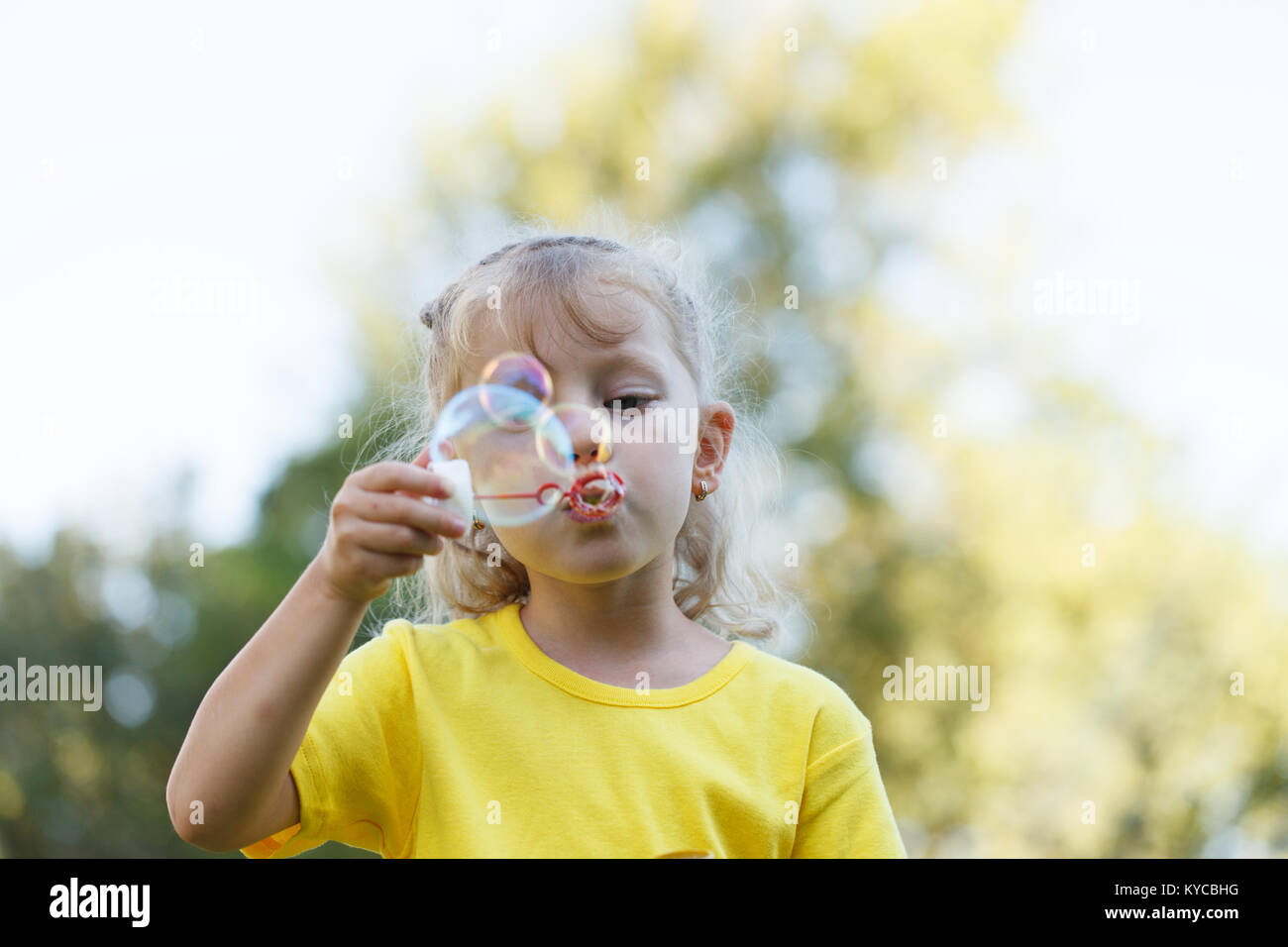 four-year-old-beauty-blowing-bubbles-skyward-stock-photo-alamy