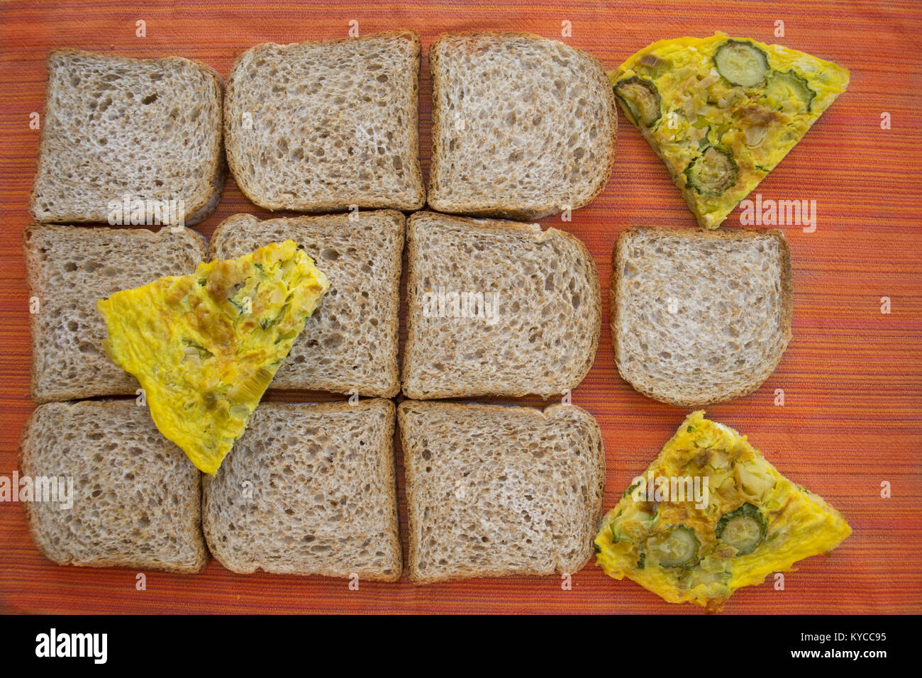 sliced wholemeal sandwich bread and zucchini omelete for a fast meal Stock Photo