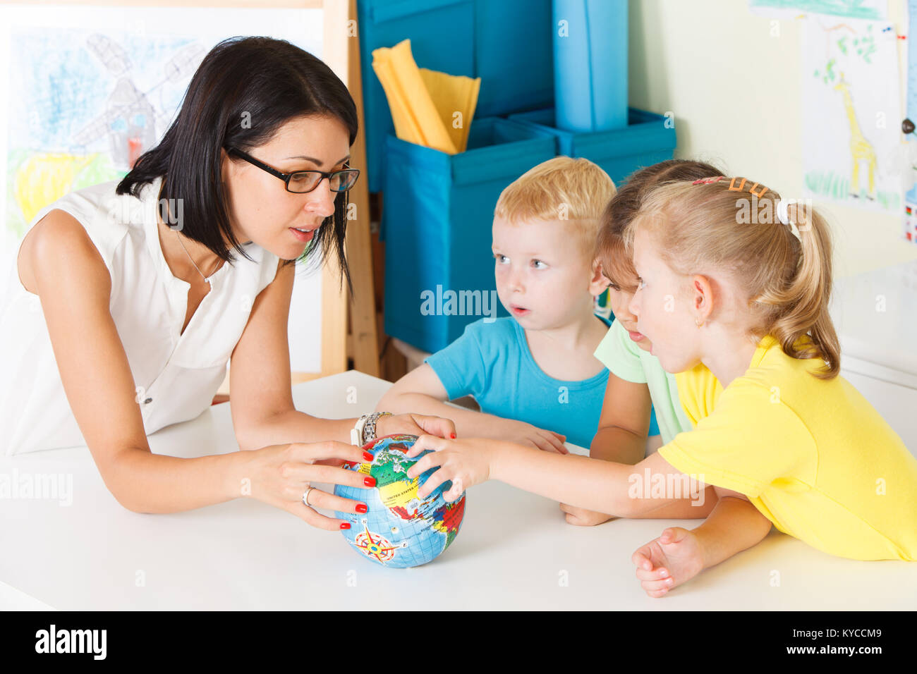 Pre-school children in the classroom with a teacher Stock Photo