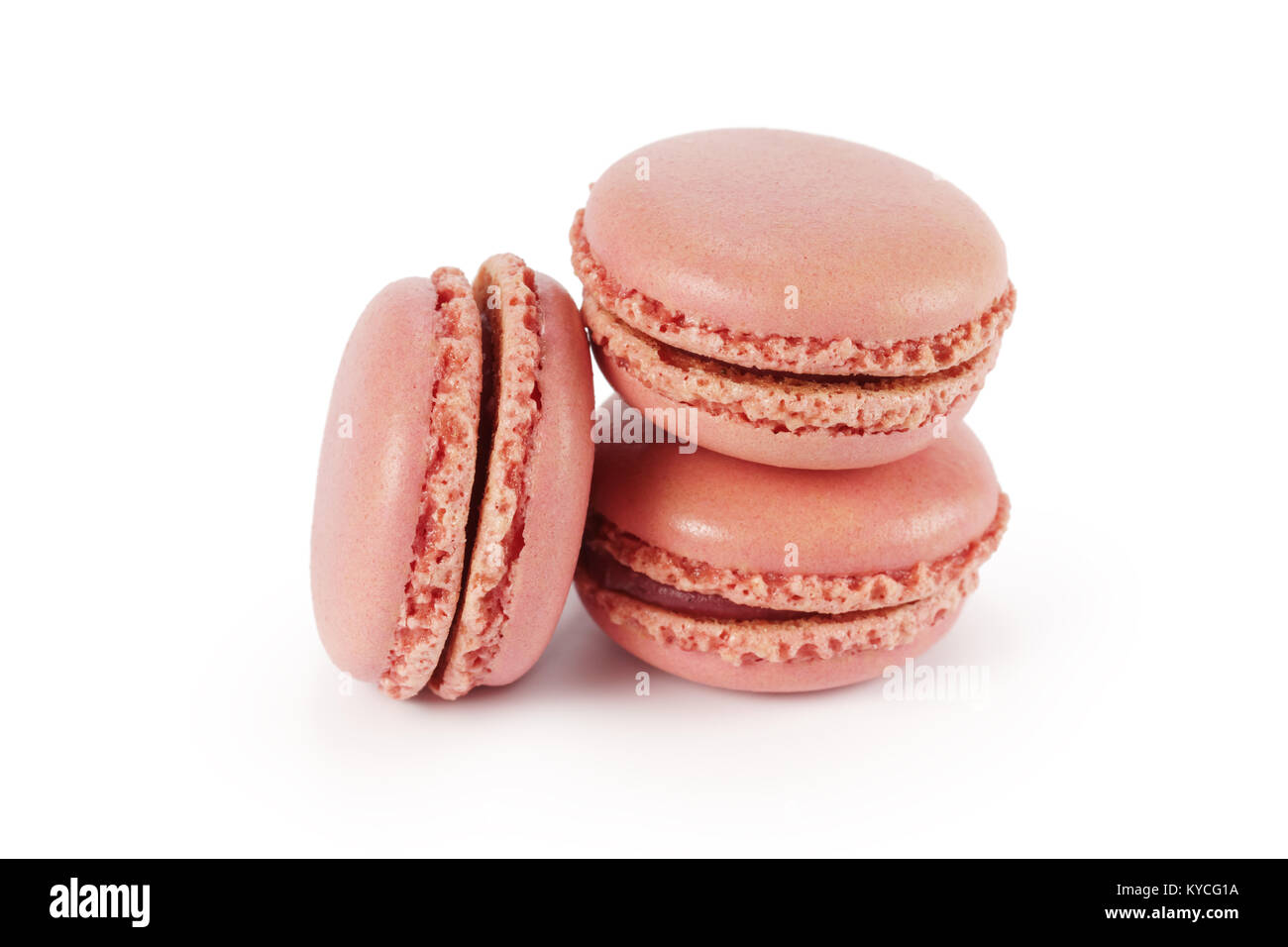 three pink macarons isolated on white background Stock Photo