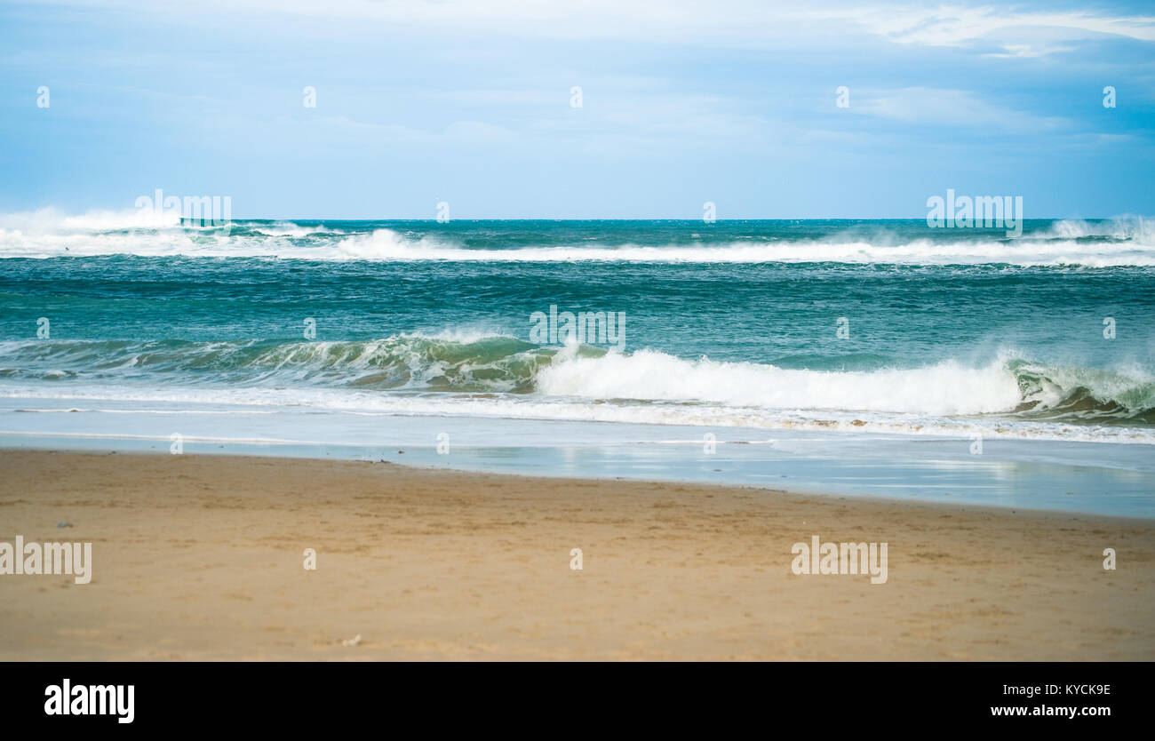 Waves sandy beach stormy beach hi-res stock photography and images - Alamy