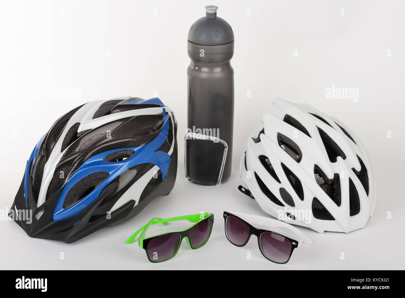 Bike accessories, bike helmets, eyeglasses and water bottle in holder