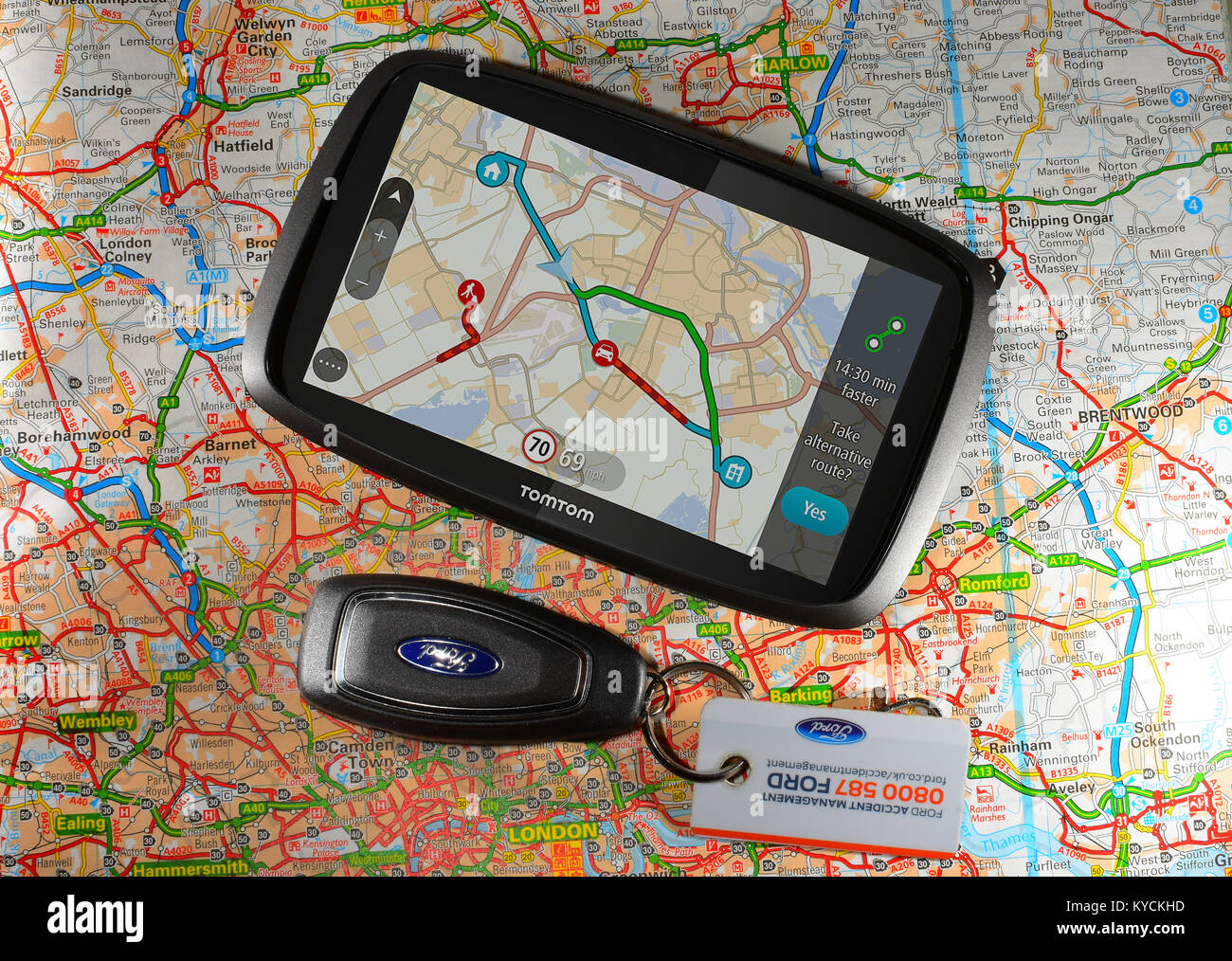 Tom-tom Sat nav with car keys and a road map Stock Photo