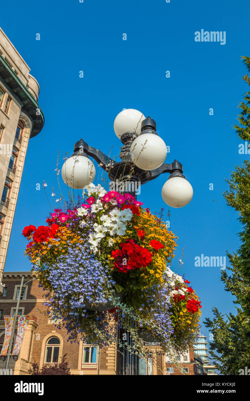 Lamp post with flowers in Inner Harbor area of Victoria Canada Stock Photo