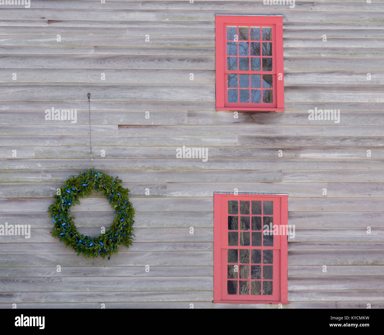 a christmas wreath on the side of an old building Stock Photo