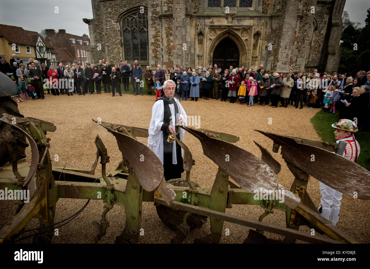 Plough Sunday, Thaxted Essex UK. 14 January 2018. Archdeacon Robin King from Stansted with a censer blesses the plough in the churchyard of Thaxted parrish church as the Thaxted Morris Men perform a ploughing dance.Plough Sunday is a traditional English celebration of the beginning of the agricultural year that has seen some revival over recent years. Plough Sunday celebrations usually involve bringing a ploughshare into a church with prayers for the blessing of the land. Accordingly, work in the fields did not begin until Plough Monday. Credit: BRIAN HARRIS/Alamy Live News Stock Photo