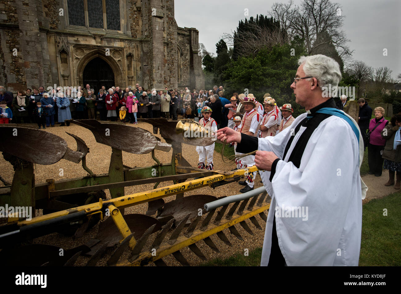 Plough Sunday, Thaxted Essex UK. 14 January 2018. Archdeacon Robin King from Stansted with a censer blesses the plough in the churchyard of Thaxted parrish church as the Thaxted Morris Men perform a ploughing dance.Plough Sunday is a traditional English celebration of the beginning of the agricultural year that has seen some revival over recent years. Plough Sunday celebrations usually involve bringing a ploughshare into a church with prayers for the blessing of the land. Accordingly, work in the fields did not begin until Plough Monday Credit: BRIAN HARRIS/Alamy Live News Stock Photo