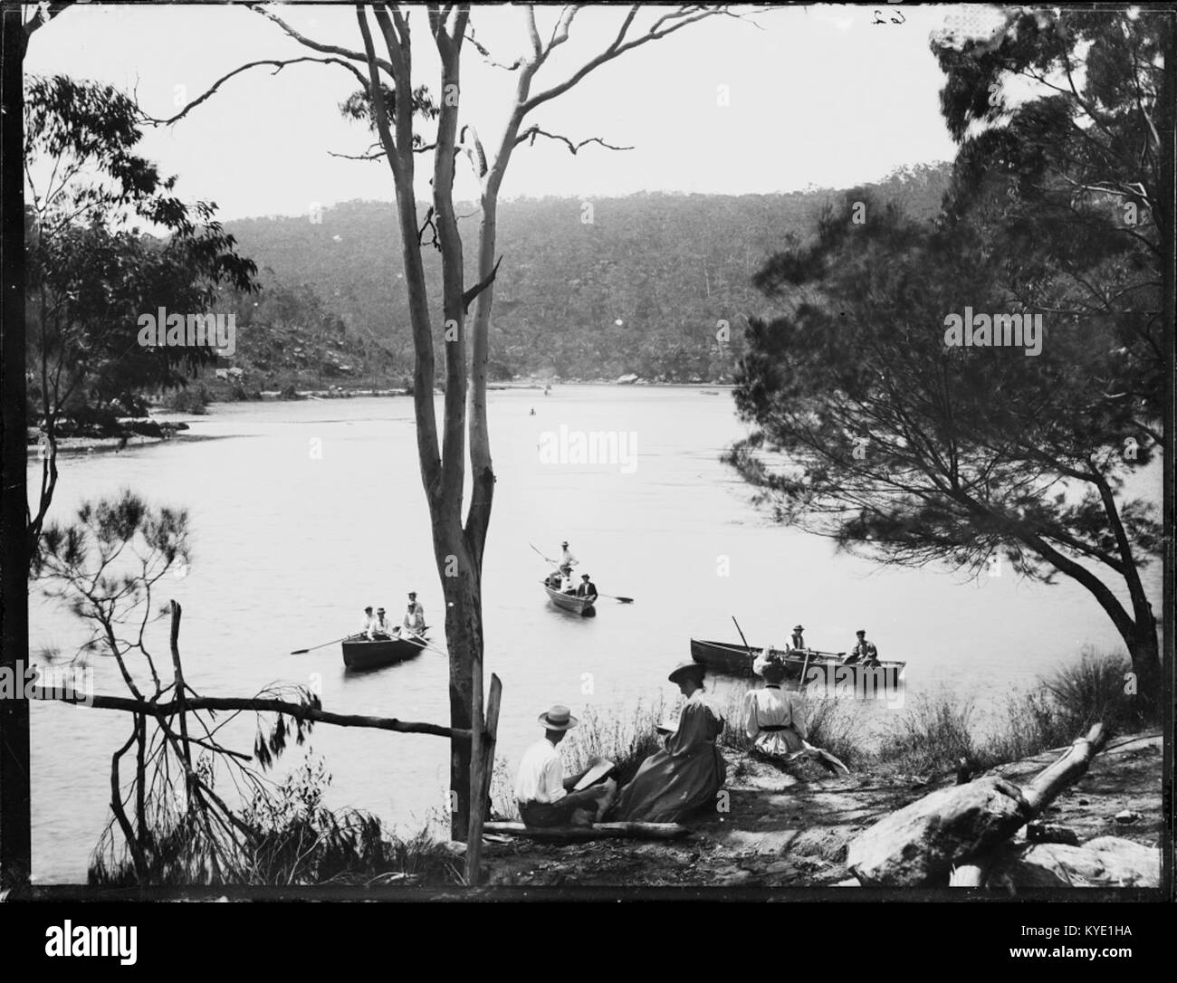 Three rowing boats on river possibly Lane Cove, with a man and woman on