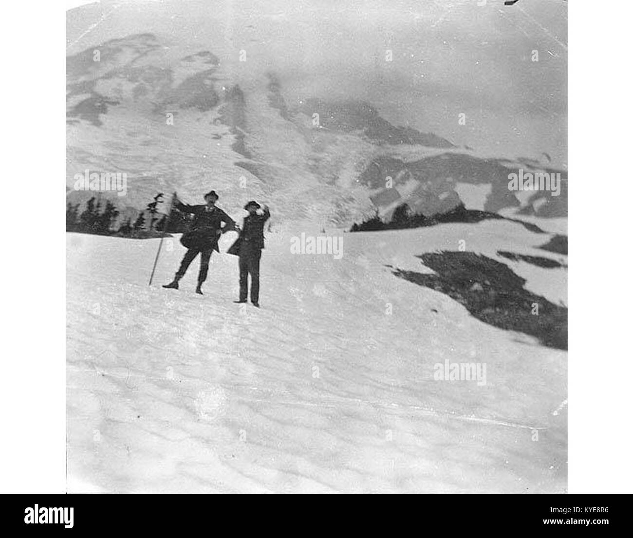 Two men, Plummer and Holmes, on a snow slope in Paradise Park, Mount Rainier, August 1896 (SARVANT 61) Stock Photo