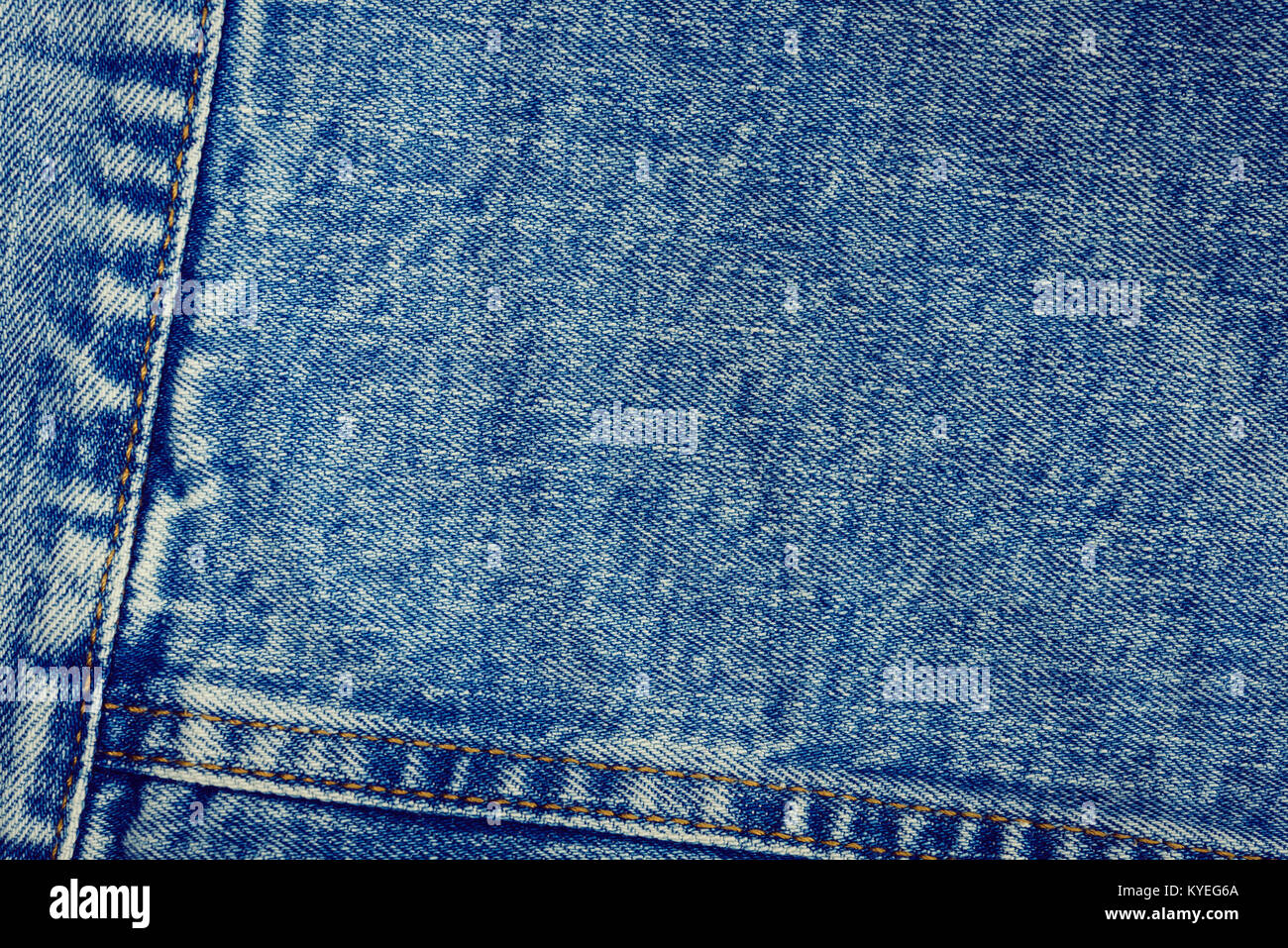 Textured vintage background - blue jeans textile denim with seam of ...