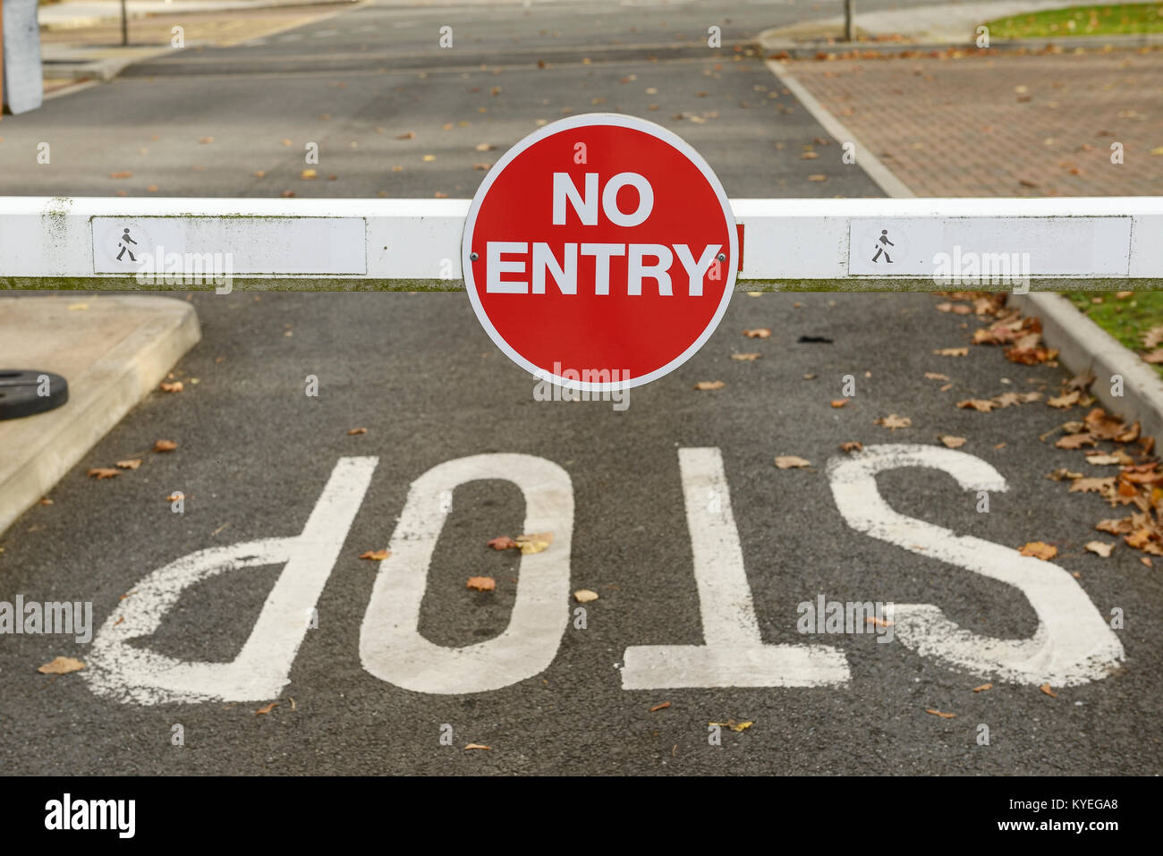 No Entry and Stop signs on a car park barrier Stock Photo