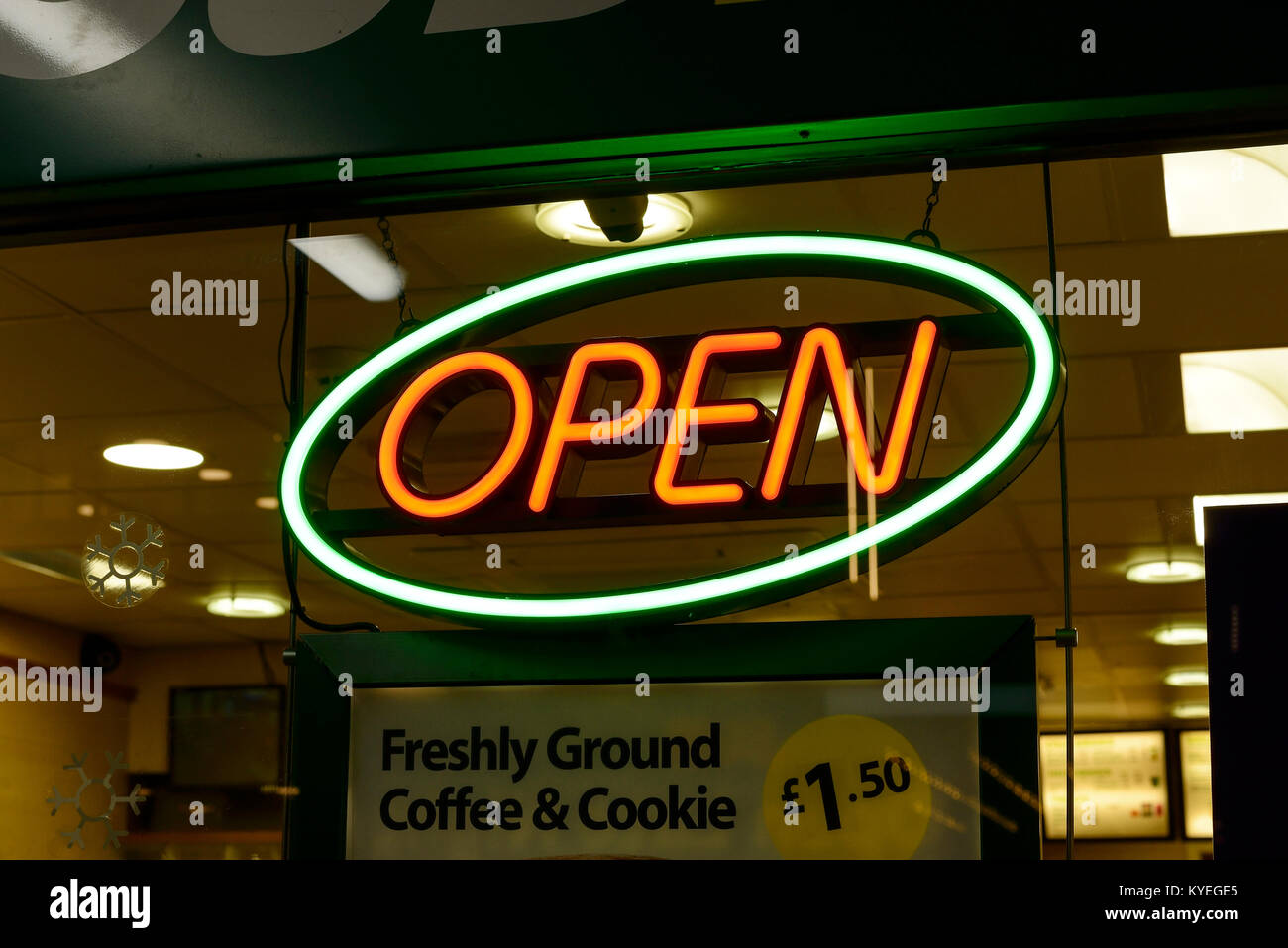 Open neon sign in the window of a takeaway restaurant Stock Photo
