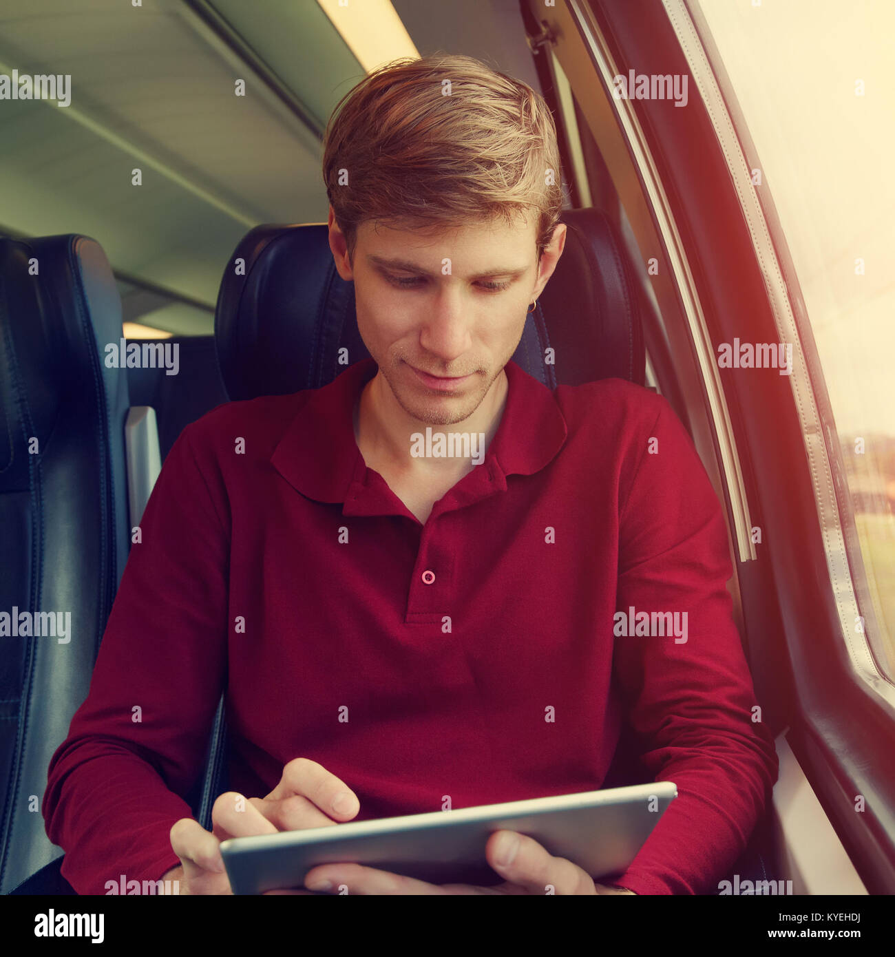 handsome man riding on a train Stock Photo