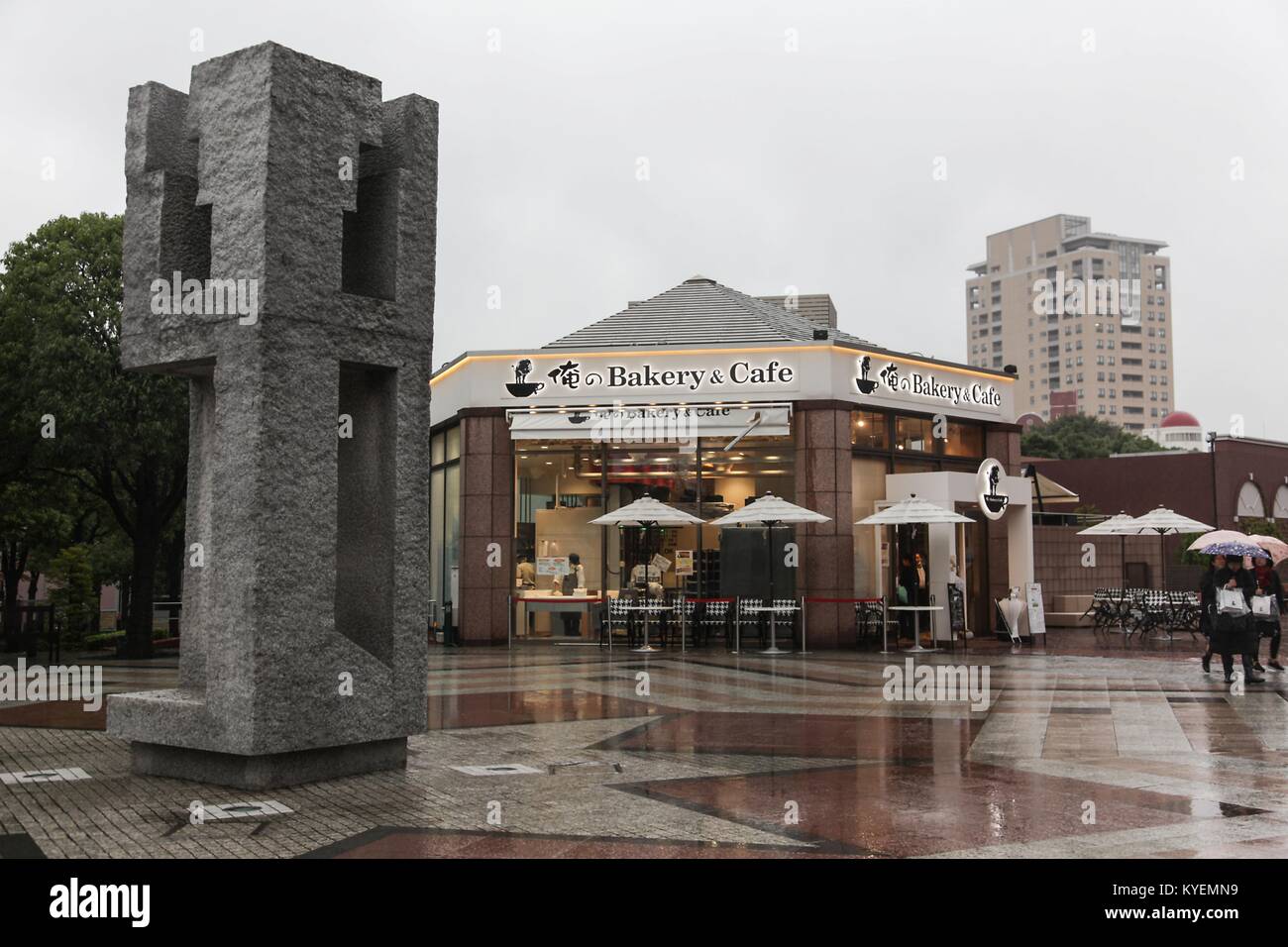 Bakery and cafe, with public art visible, near Ebisu Station in Yebisu Garden Place, a popular shopping area, on a rainy day in Shibuya ward, Tokyo, Japan, October 16, 2017. () Stock Photo