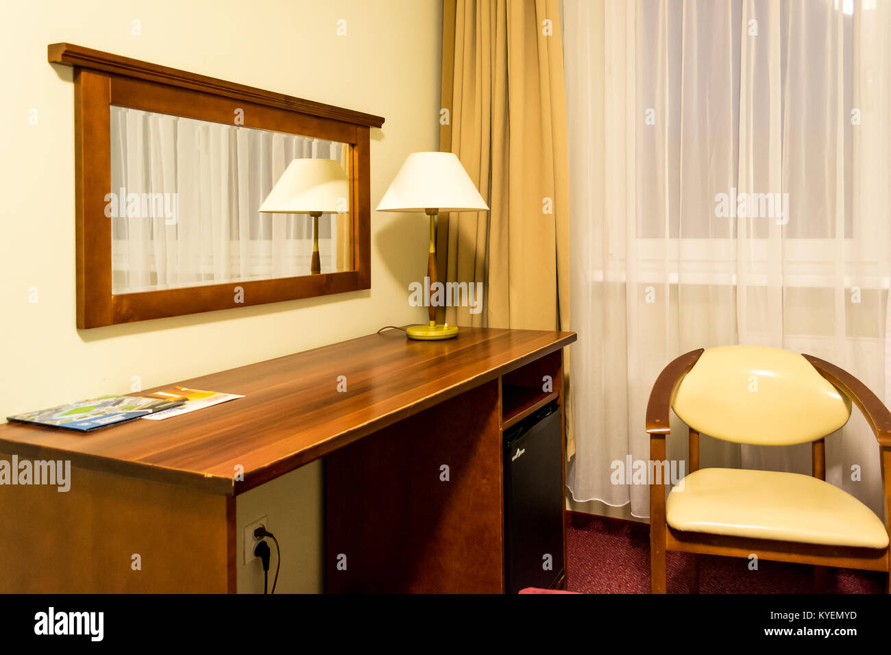 Bedroom with desk and mirror Stock Photo Alamy
