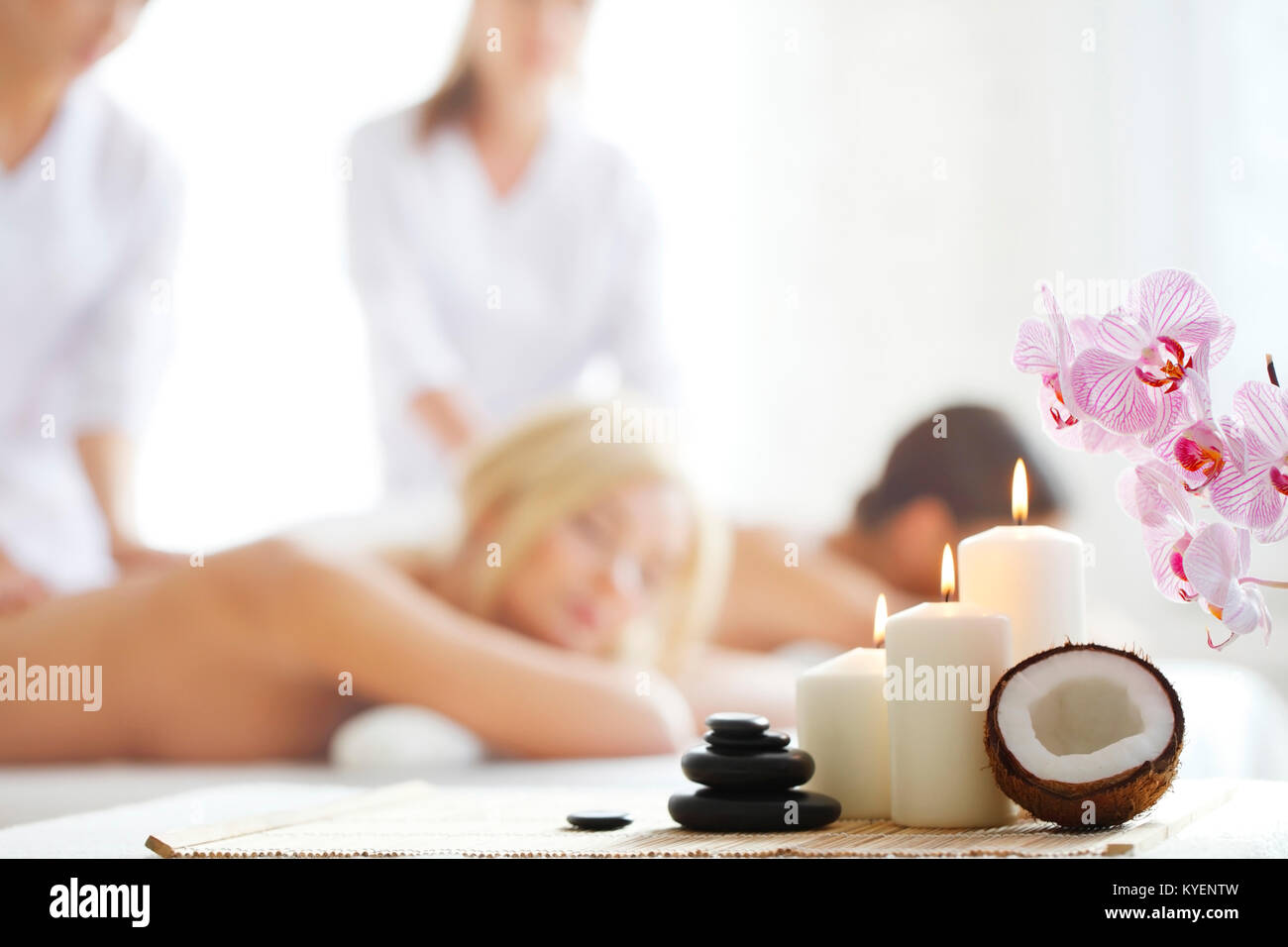 Spa massage tools and women getting massage on background Stock Photo